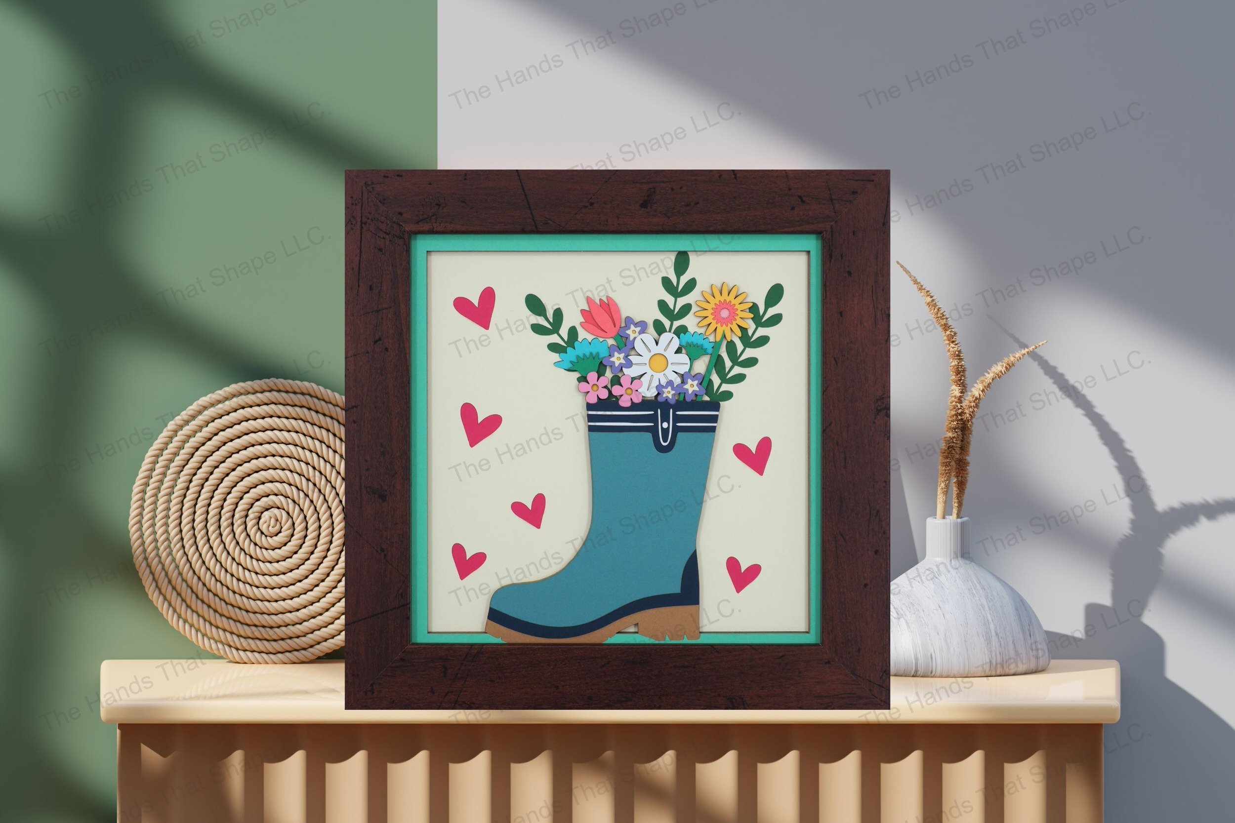 Admire this charming spring rainboot flower bouquet-themed cardstock artwork, displayed on a table, showcasing its vibrant layers and playful, floral charm.