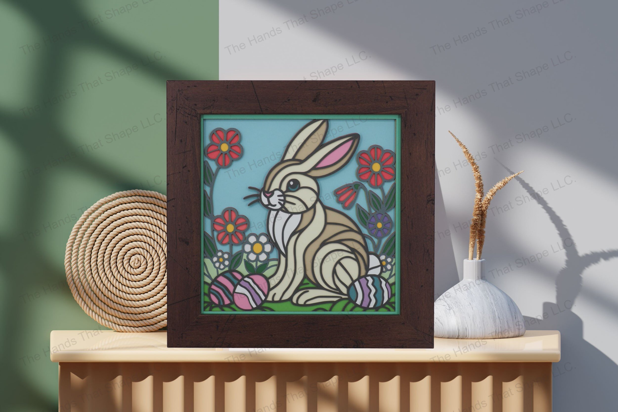 Admire this vibrant Easter Bunny-themed cardstock artwork, displayed on a table by a wall, showcasing its intricate layers and festive springtime colors.