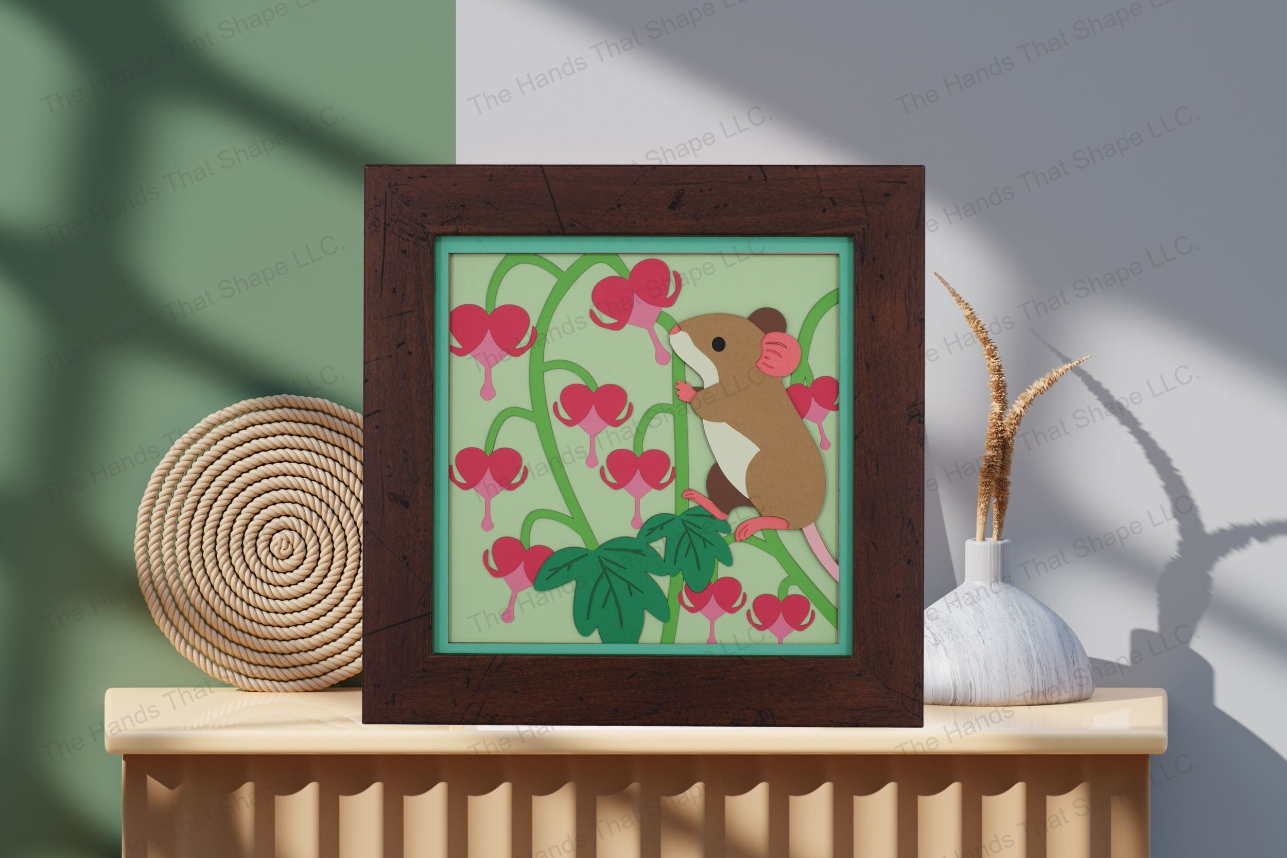 Admire this enchanting mouse and bleeding heart flowers-themed cardstock artwork, beautifully displayed on a table, highlighting its intricate floral details.