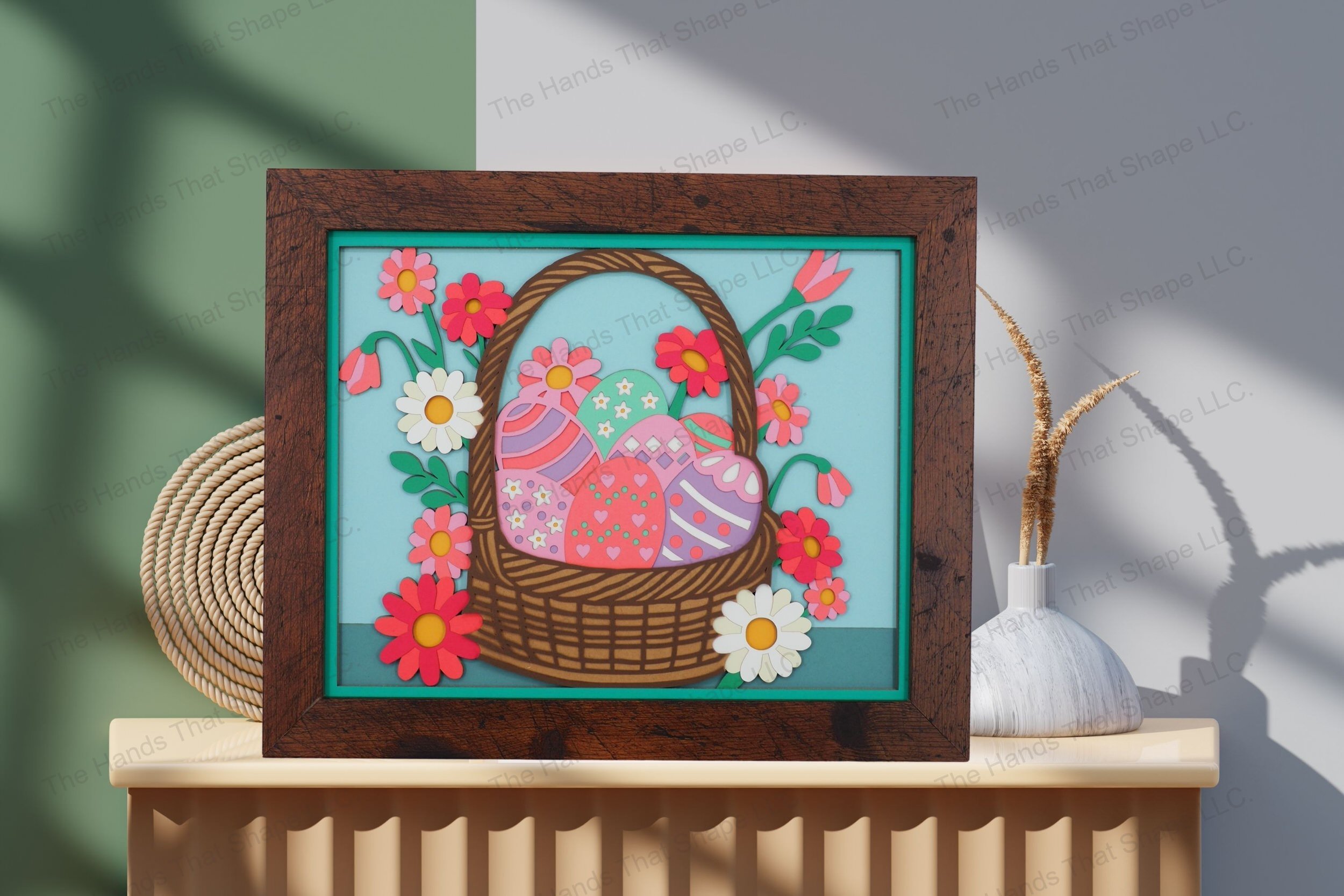 Admire this festive Easter basket-themed cardstock artwork, displayed on a table, highlighting its vibrant layers and detailed springtime embellishments.