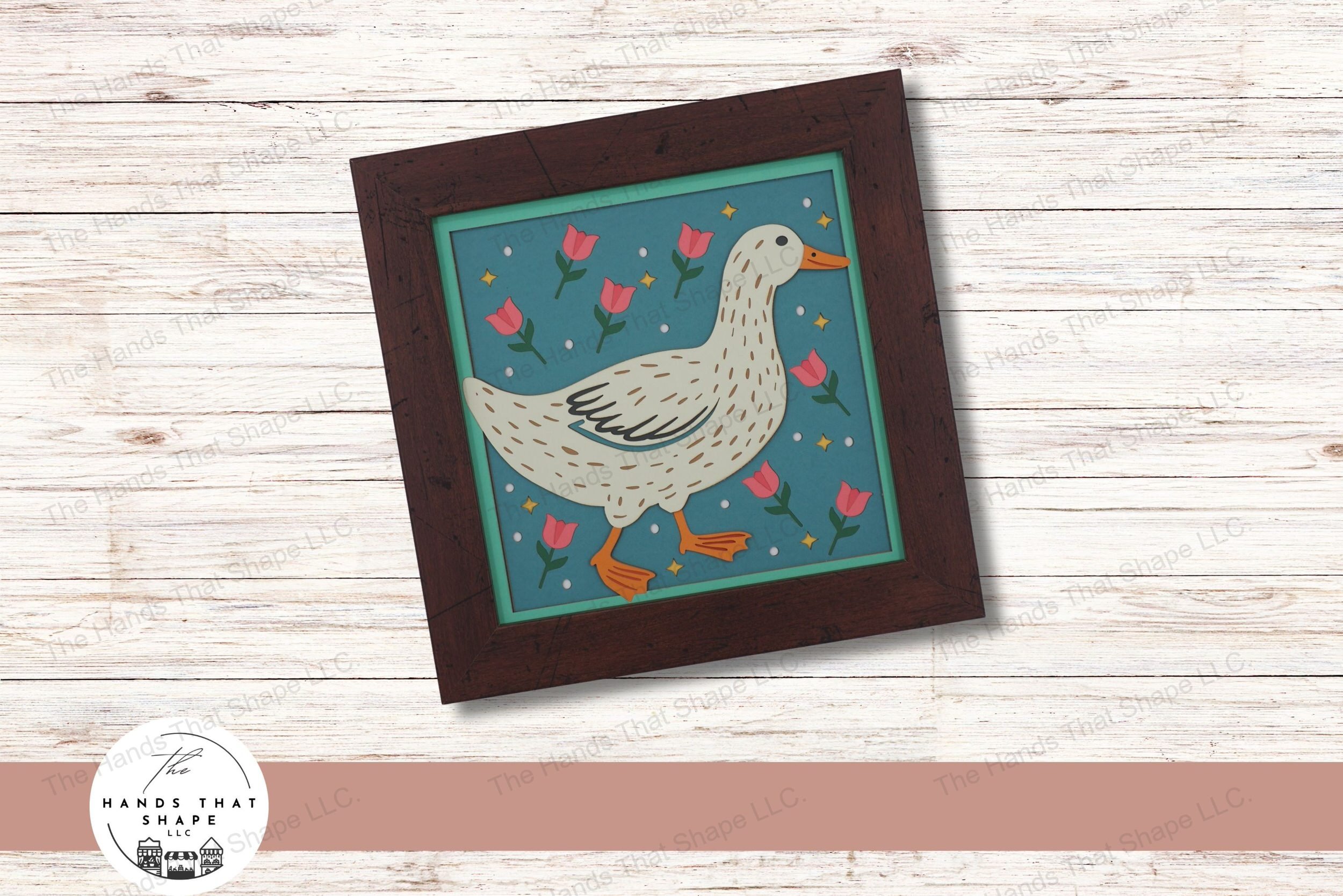 This layered cardstock art piece vividly portrays a folksy duck walking through a colorful scene of tulips and stars, creating a whimsical and vibrant display.