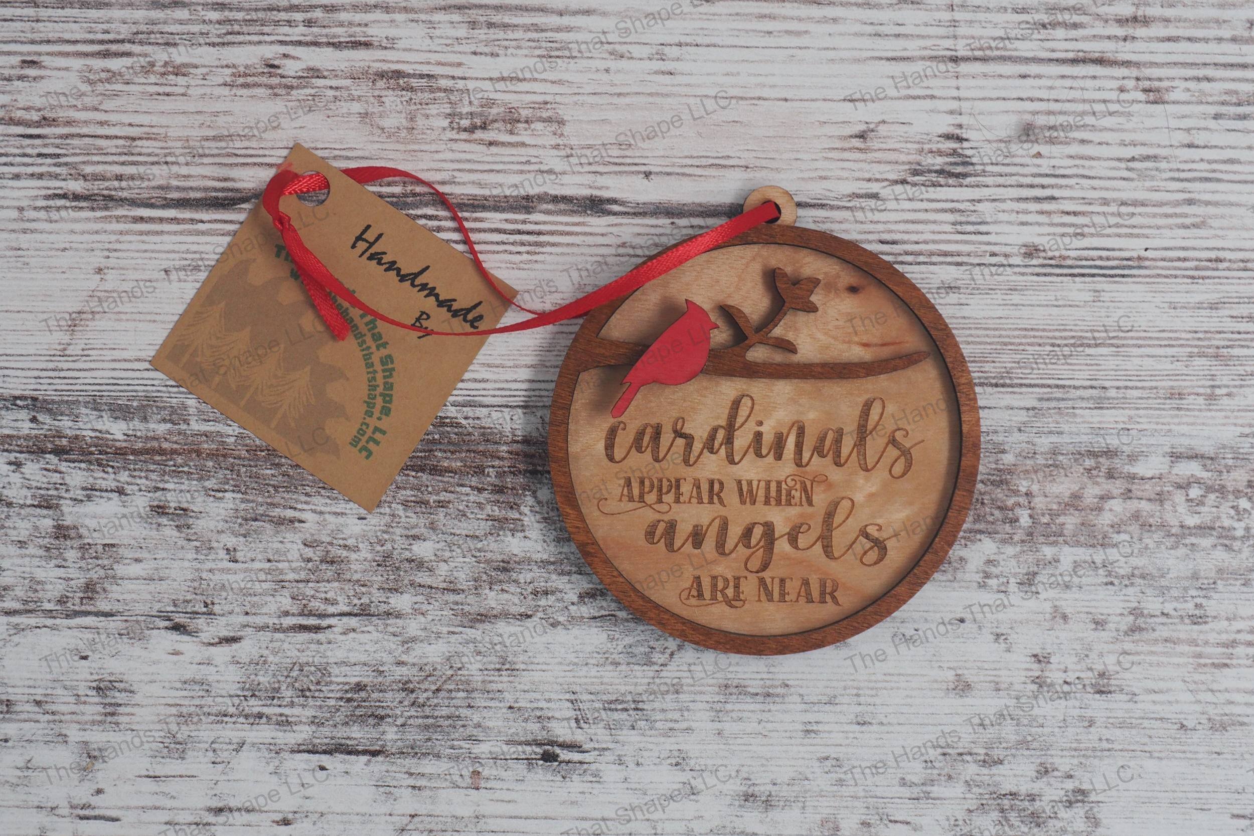 Wooden remembrance ornament featuring the engraved phrase "Cardinals appear when angels are near" along with one cardinal.