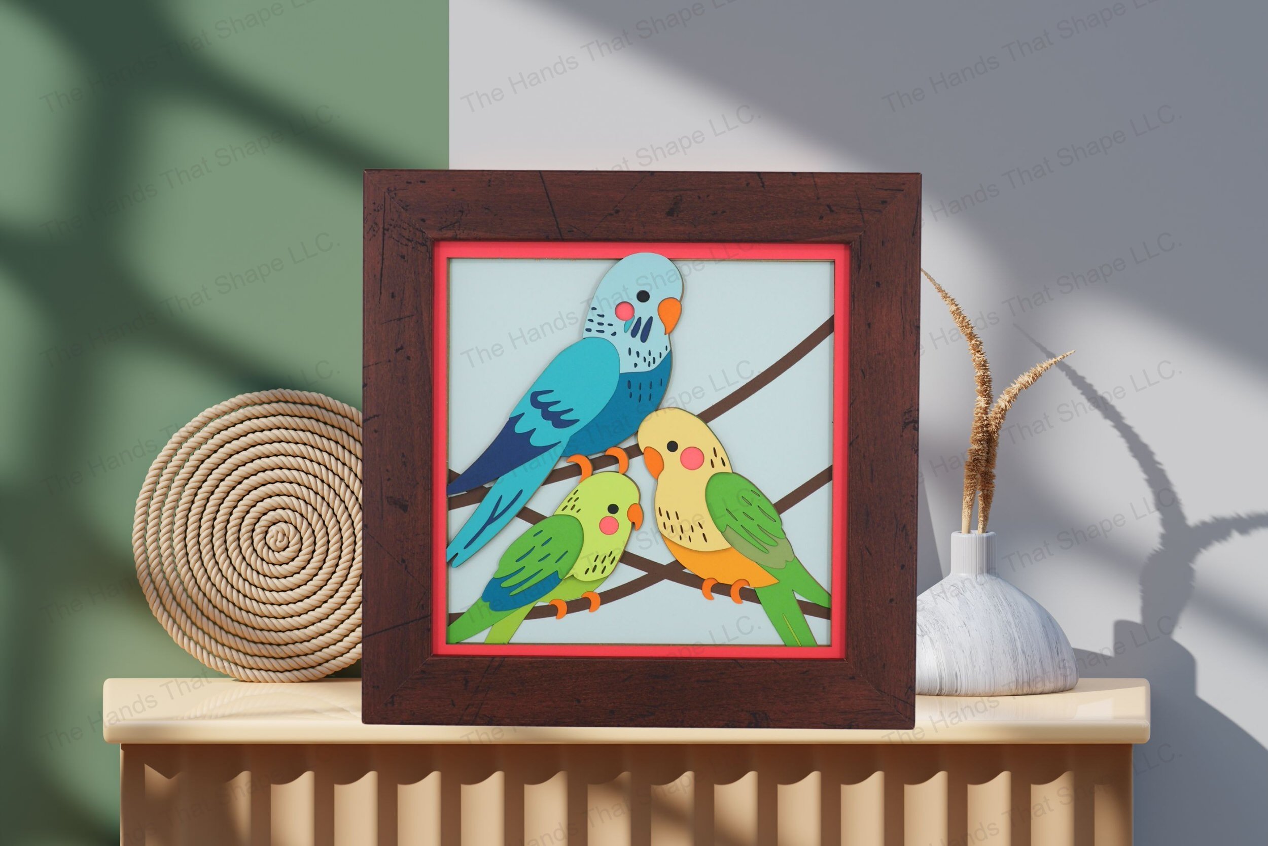 Admire this cheerful parakeet-themed layered cardstock artwork, beautifully displayed on a table, showcasing its vibrant colors and detailed dimensional design.