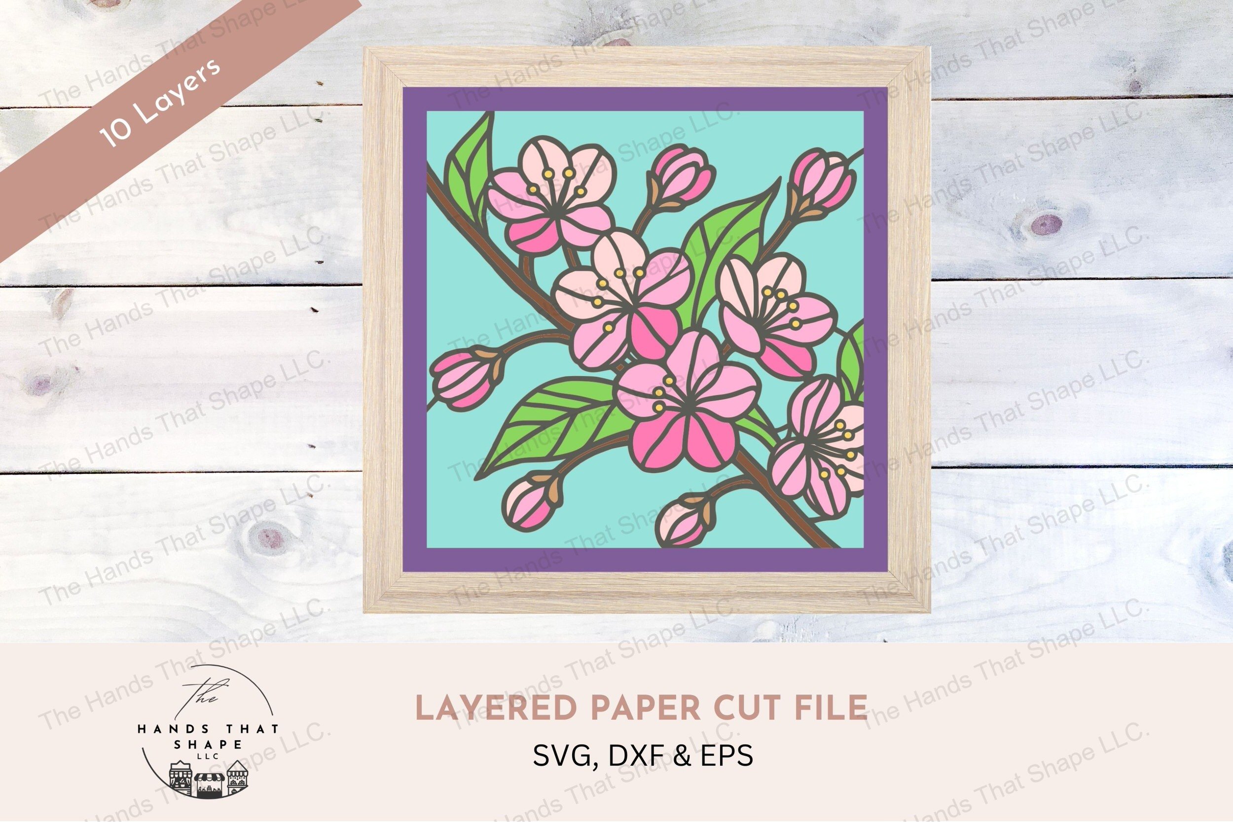 This layered cardstock art piece elegantly depicts a cherry blossom branch in full bloom, capturing the soft colors of each blossom and leaf.