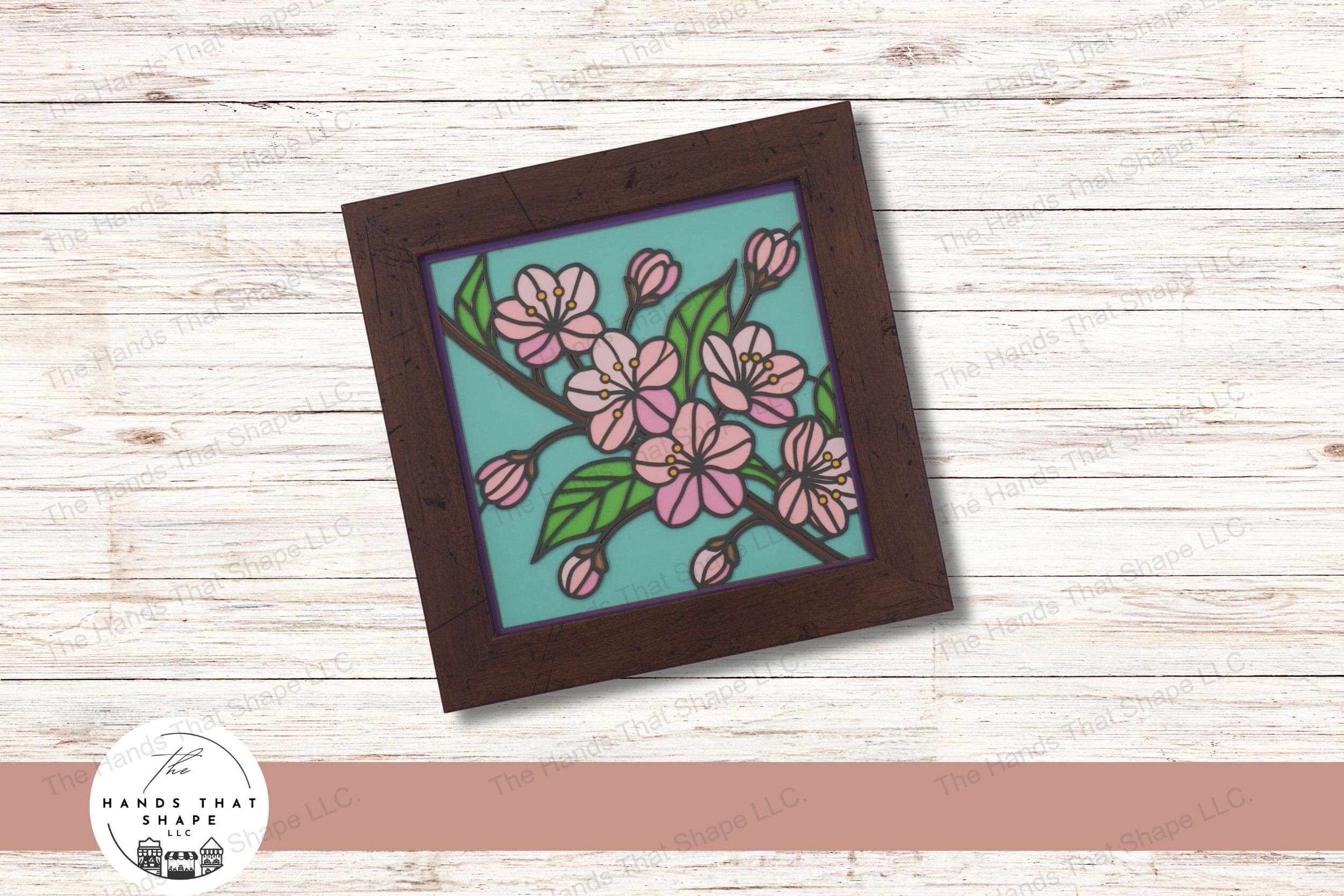 This layered cardstock art piece elegantly depicts a cherry blossom branch in full bloom, capturing the soft colors of each blossom and leaf.