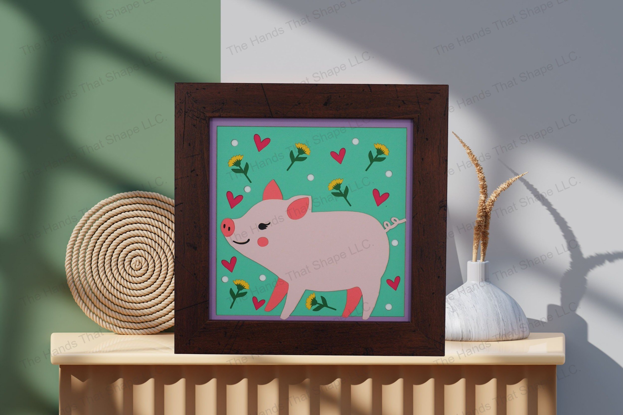 Admire this folksy piglet-themed cardstock artwork, thoughtfully displayed on a table, showcasing its vibrant layers and playful, heartwarming details.
