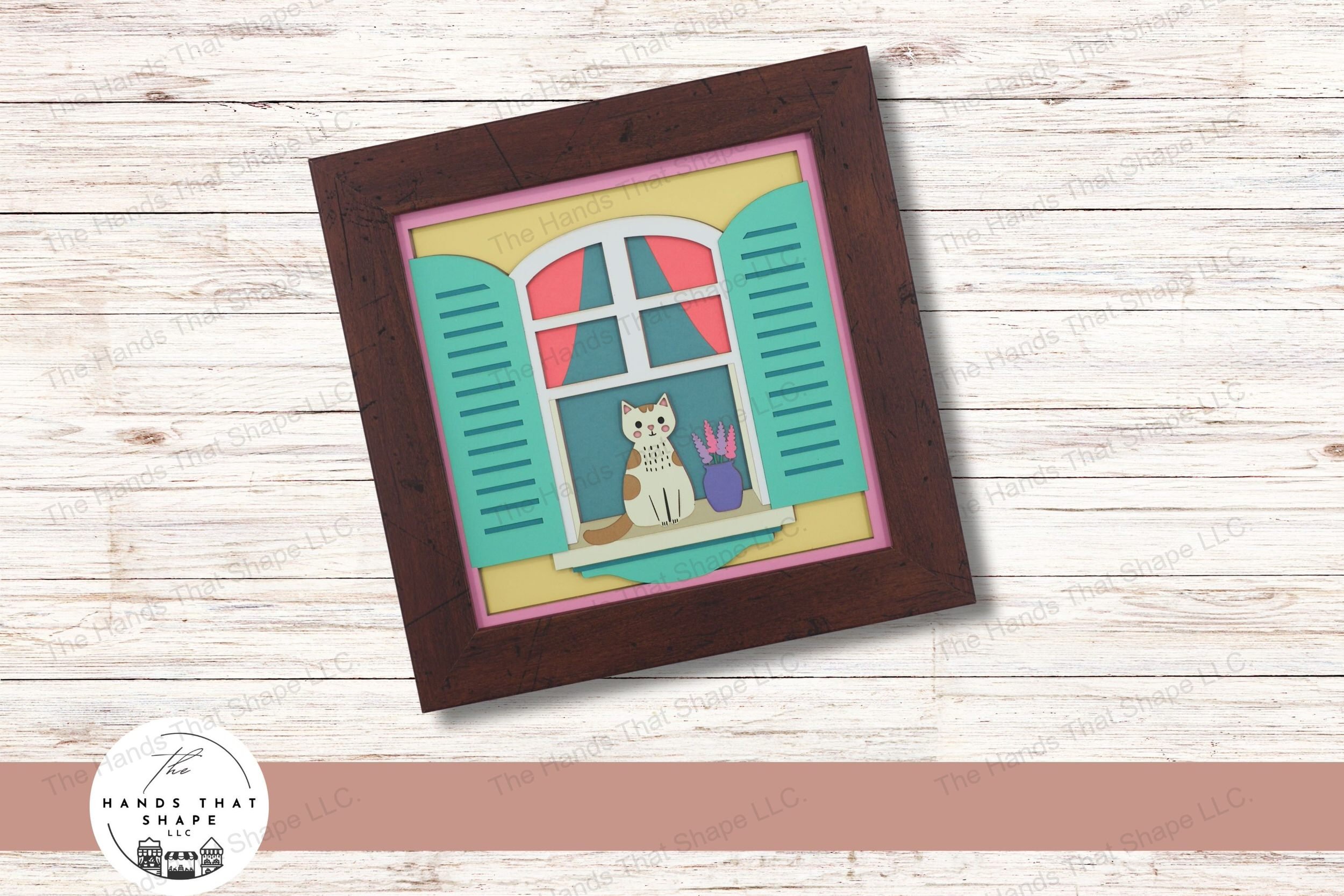 This layered cardstock art piece shows a tranquil scene of a cat sitting on a window sill, offering a glimpse of cozy indoor life from an outdoor perspective.