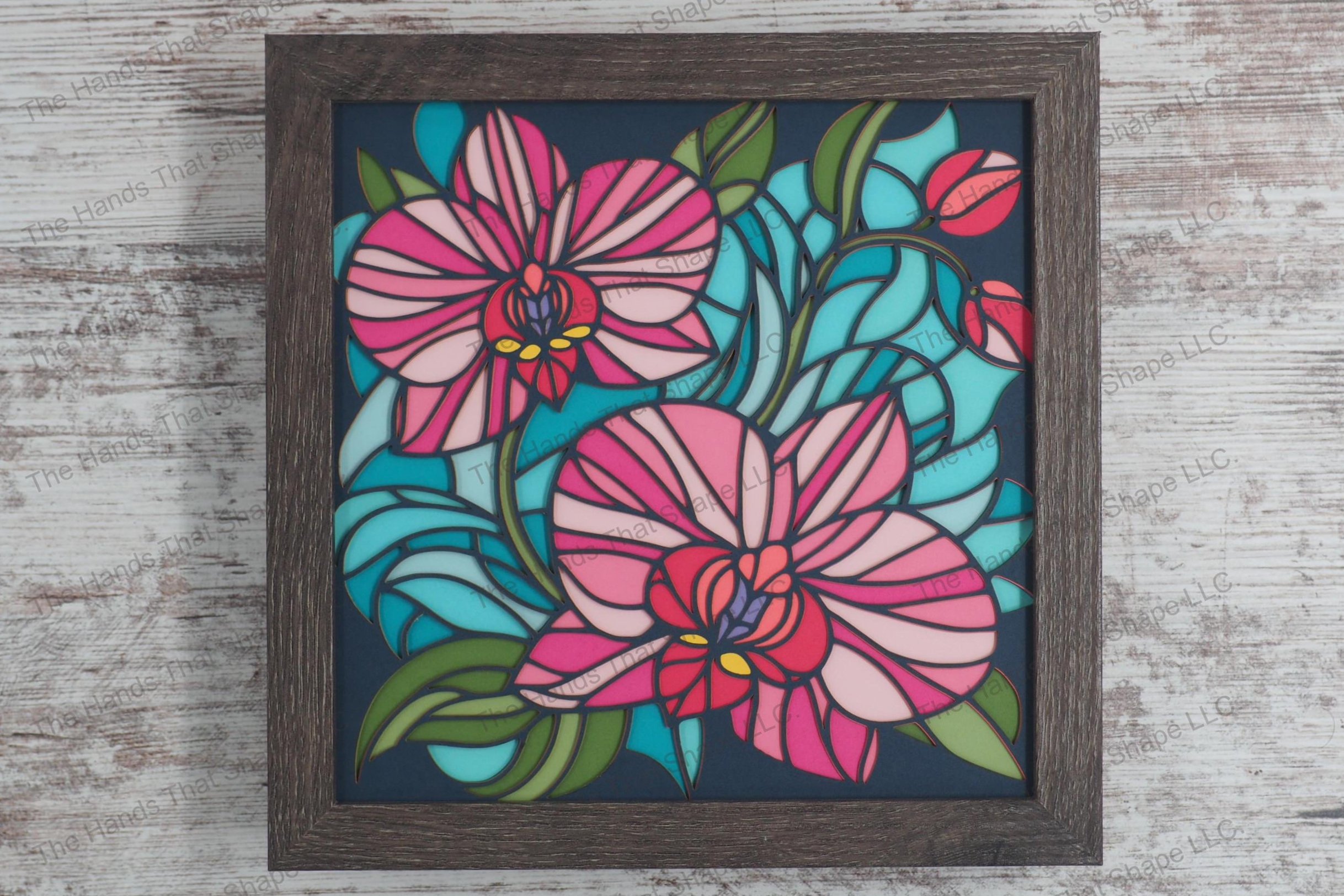 Discover the delicate beauty of orchids with this layered paper shadowbox art, featuring two prominent orchid flowers and emerging buds set against lush leaves.