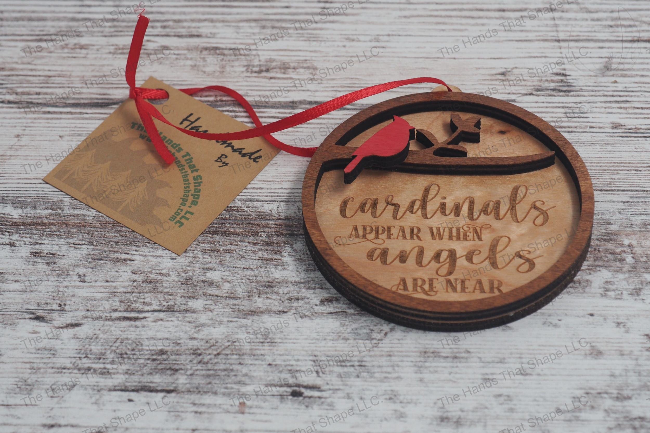 Wooden remembrance ornament featuring the engraved phrase "Cardinals appear when angels are near" along with one cardinal.