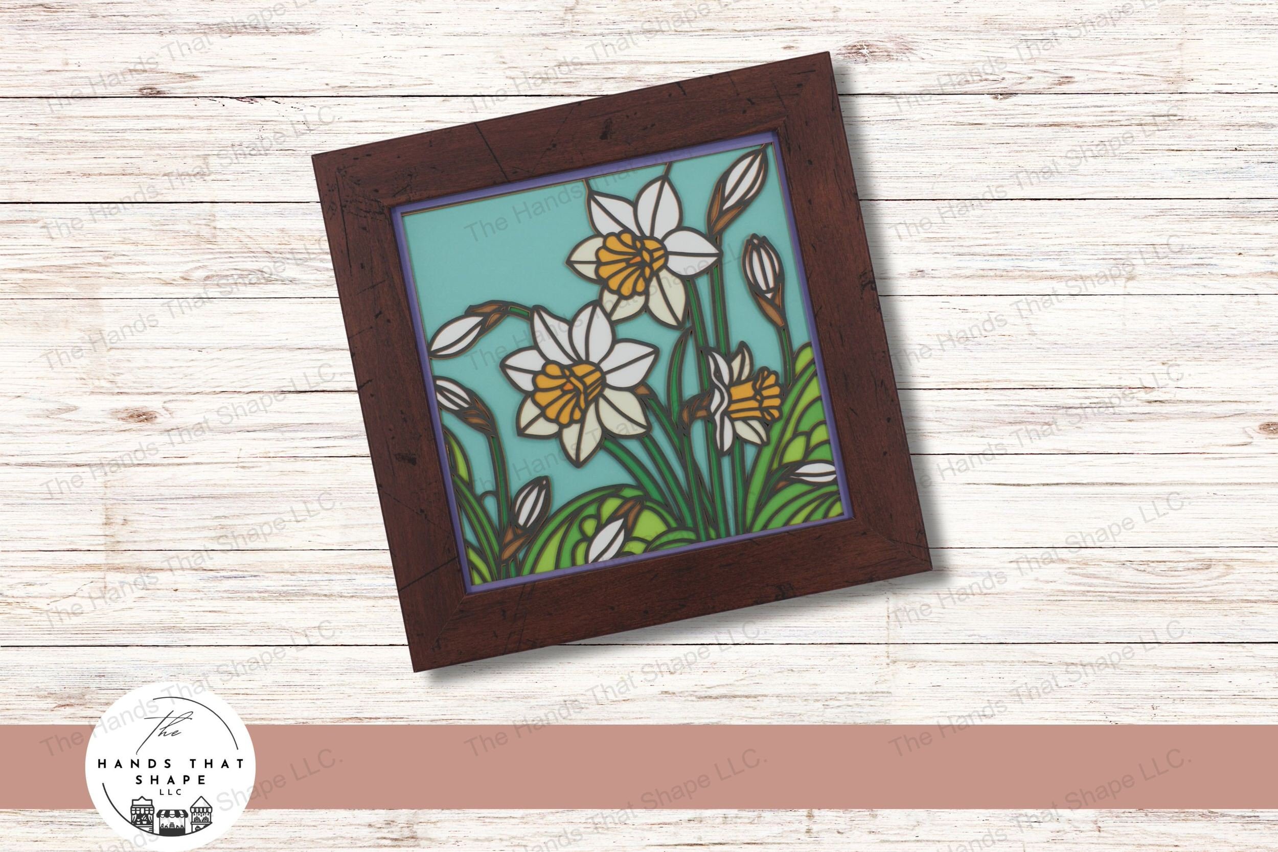 This layered cardstock digital design file beautifully captures multiple daffodils in various stages of bloom, complete with leaves and grasses.