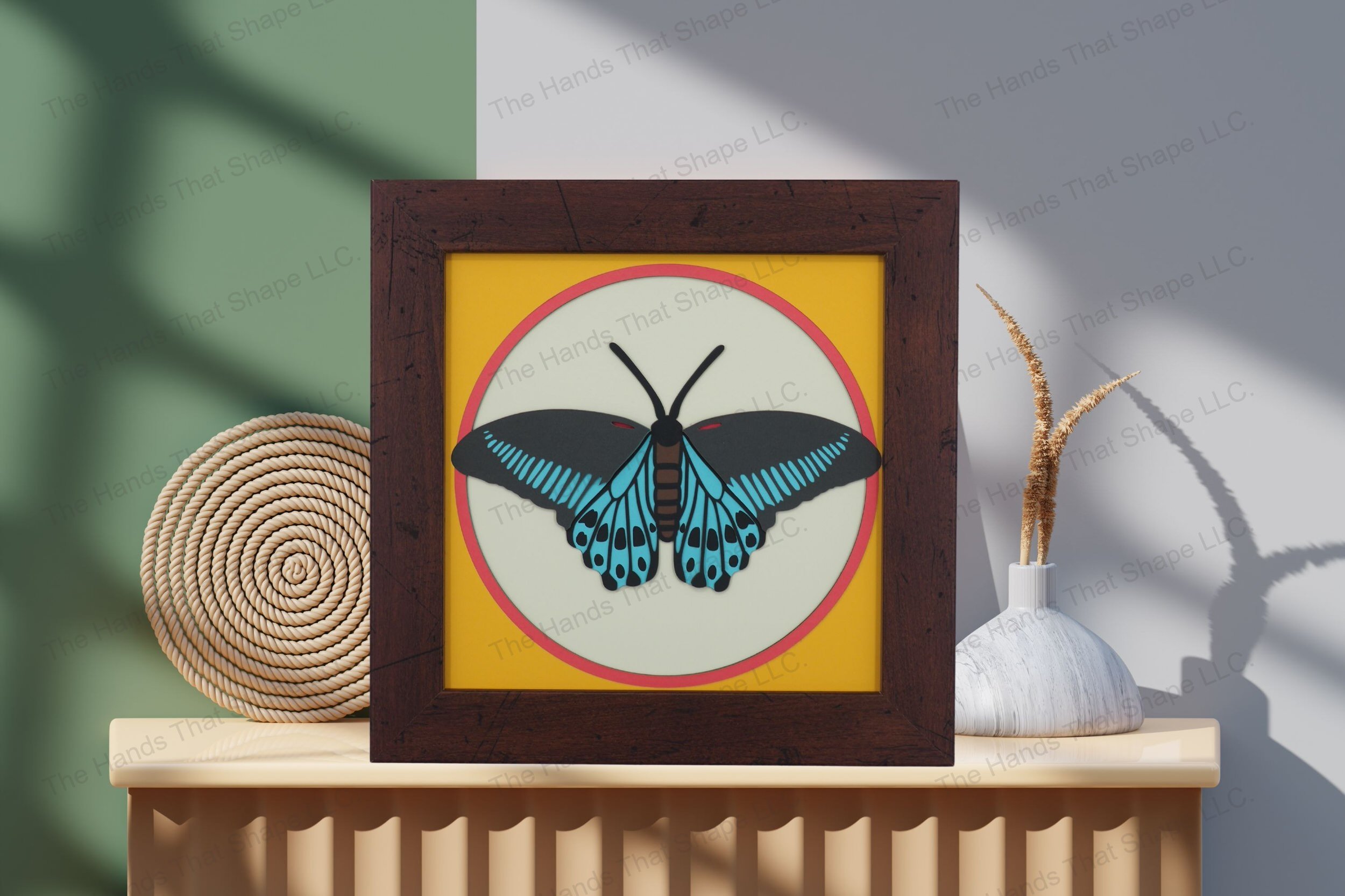 Admire the Blue Mormon Butterfly-themed cardstock artwork, displayed on a table, showcasing its intricate detail in a visually stunning arrangement.