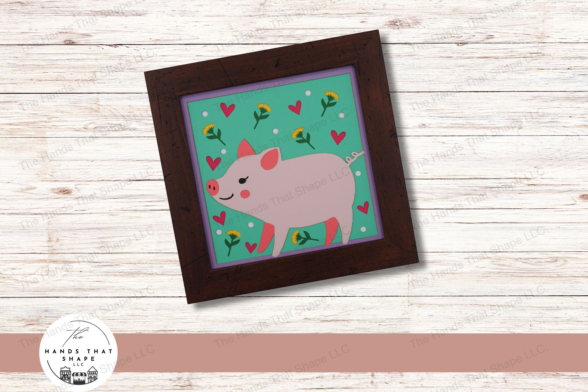 This layered paper design captures the charm of a folksy piglet, set against a backdrop of flowers, dots, and hearts, creating a whimsical and inviting scene.