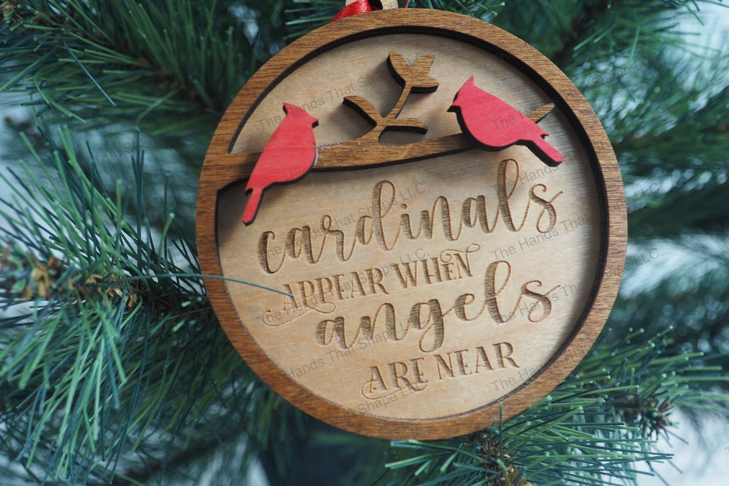 Enhance your Christmas tree with our heartfelt remembrance ornaments, each beautifully crafted with engraved sentiments and two vibrant cardinals.