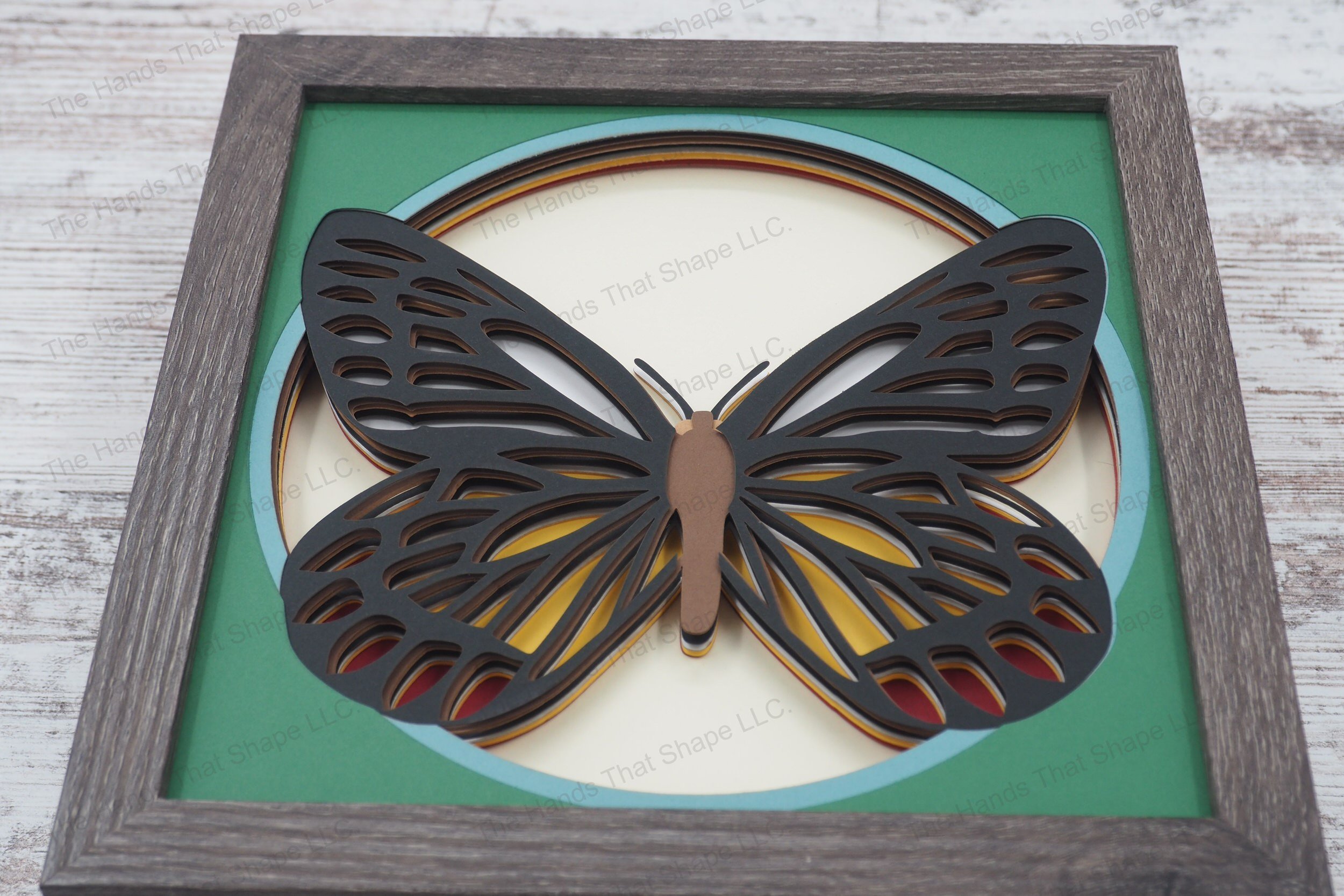 Showcase the natural elegance of the Delias eucharis butterfly with this detailed shadowbox, featuring the butterfly's vividly patterned wings spread out.