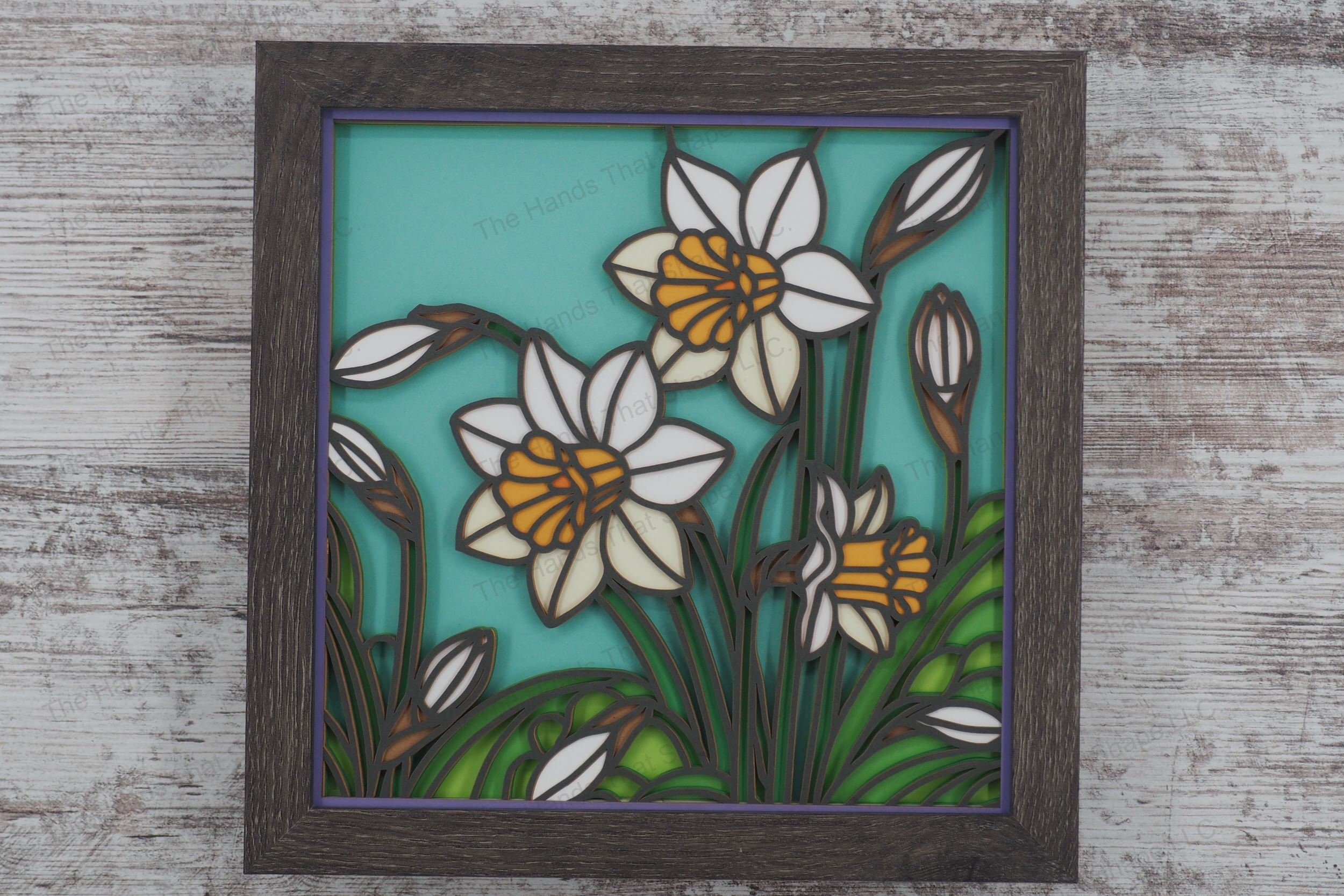 Immerse yourself in the vibrancy of spring with this layered paper shadowbox, showcasing multiple daffodils in various stages of bloom, in a stained glass style