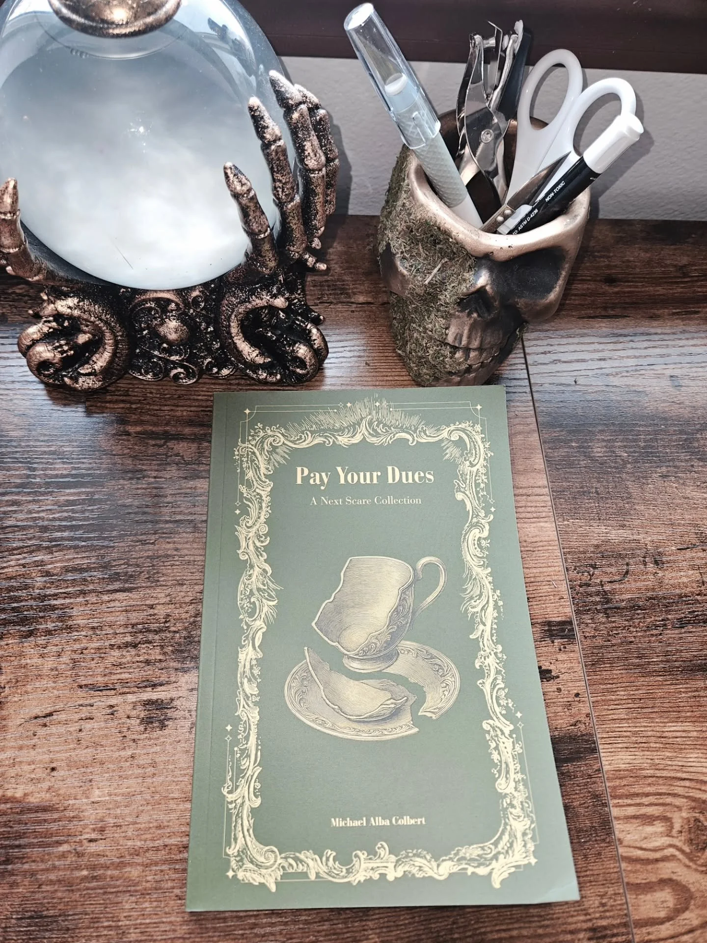 "To my wife and my little ones &mdash; you guys are the light that makes it okay to write nightmares."

My debut horror anthology is officially out.
Pay Your Dues: A Next Scare Collection is about a man who discovers a strange bundle of sto