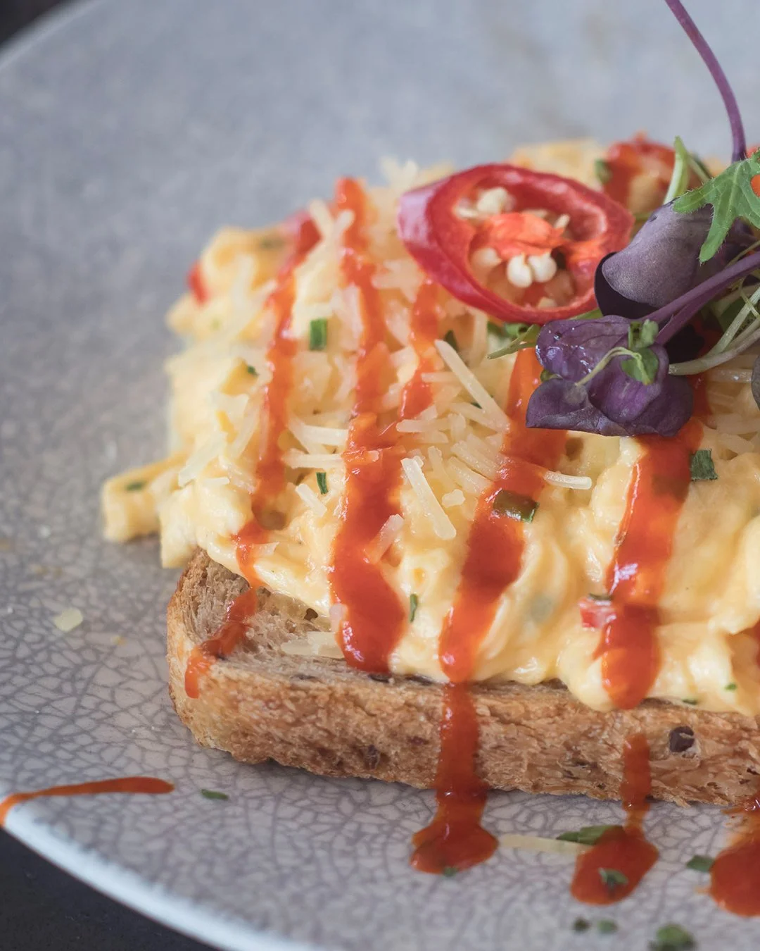 🌶️🍳Loved Scrambled Eggs, but feel like giving them a hit of fire to add some zest to your morning? 🌶️🍳

Then try our Chili Scrambled Eggs - classic scrambled eggs on toast with a hit of hot Sriracha sauce and fresh chili, along with a sprinkling 