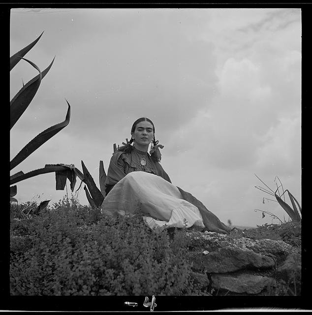 Frida Kahlo seated next to an agave plant.jpg