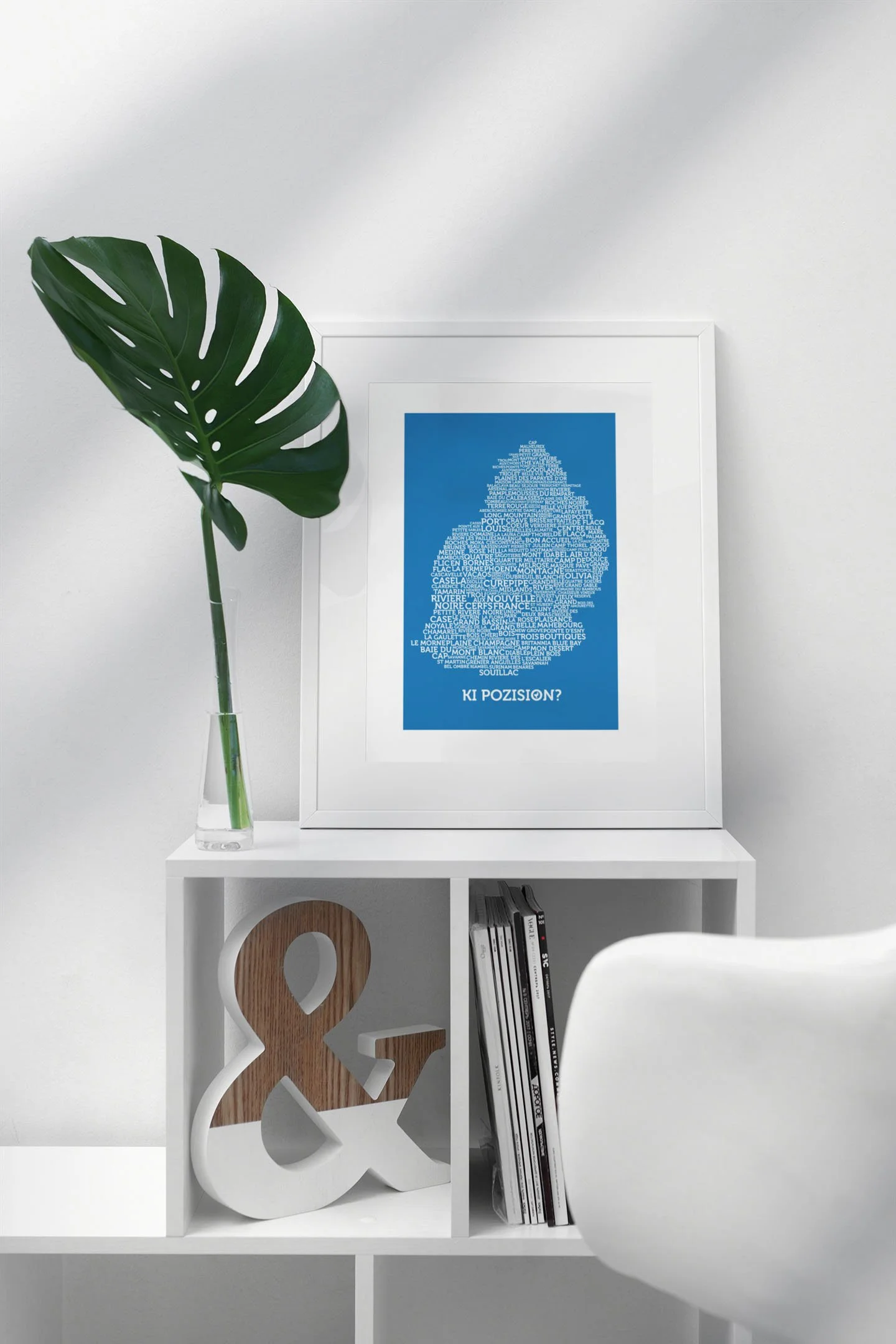 mockup-featuring-a-picture-frame-standing-on-top-of-a-small-white-bookcase-499-el.jpg