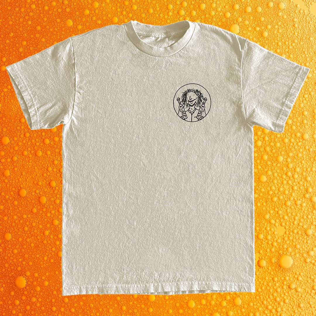Zak's Kombucha 'IYKYK' Merch. Fair Trade and Vegan Cotton Off-white T-shirt on Orange bubbling background