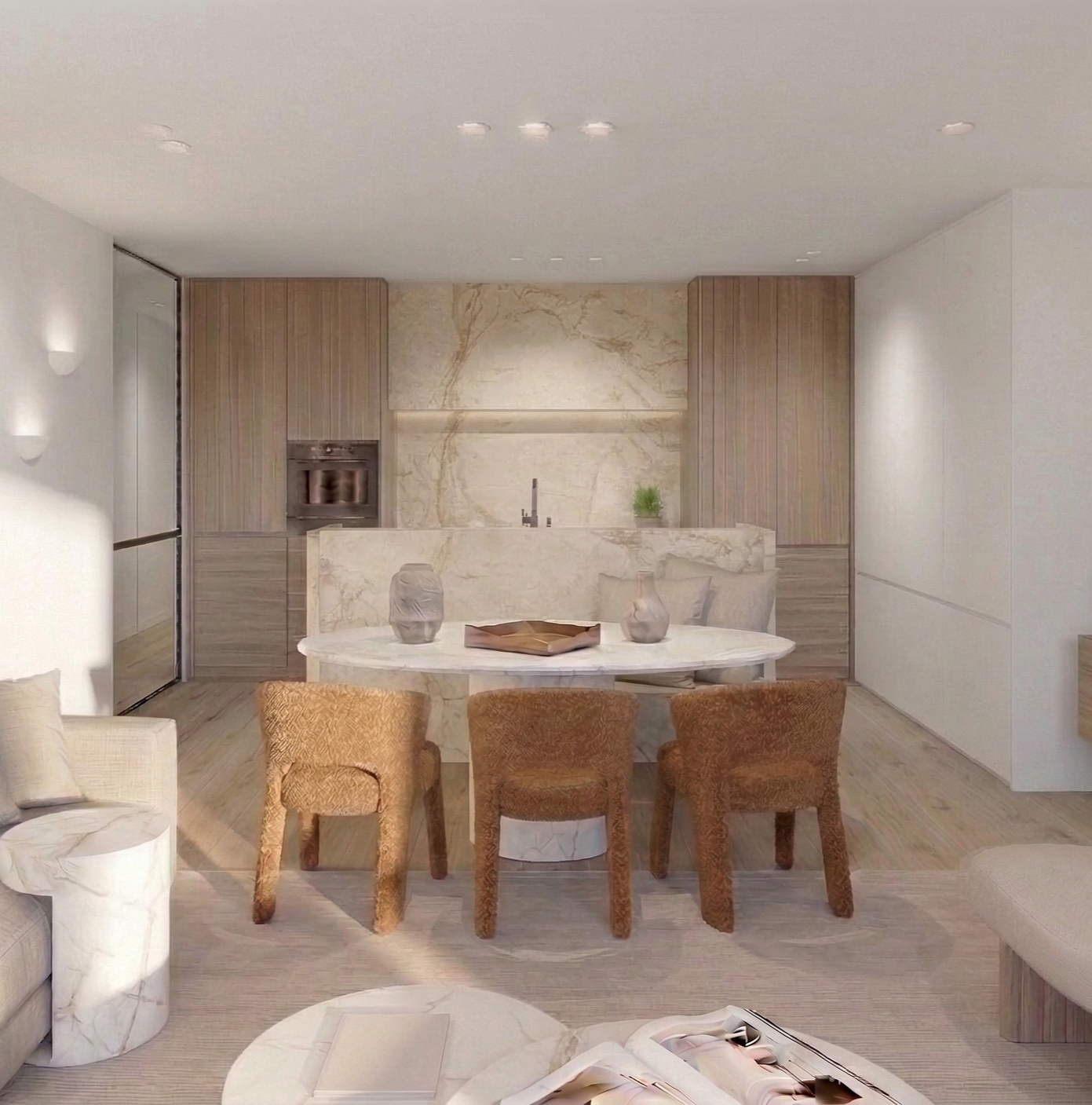 Modern, open-plan keuken en eetkamer met marmeren tafel en drie kuipstoelen, lichte houten kasten en neutrale kleuren.