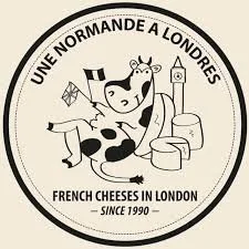 Logo of Une Normande A Londres featuring a cow with cheese and the London Eye in the background.