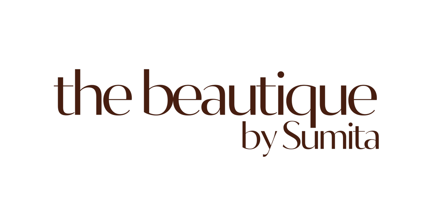 Text that says "the boutique by Sumita" in brown on a black background.