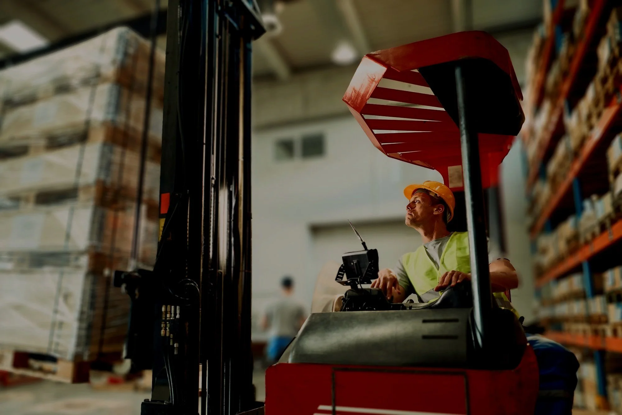 warehouse-worker-moving-pallets-with-forklift-industrial-building.jpg