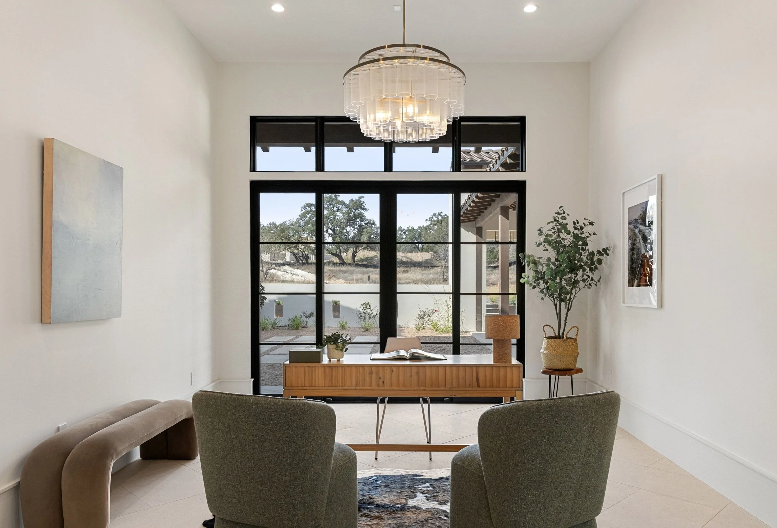Home office featuring expansive views, workspace, and contemporary lighting