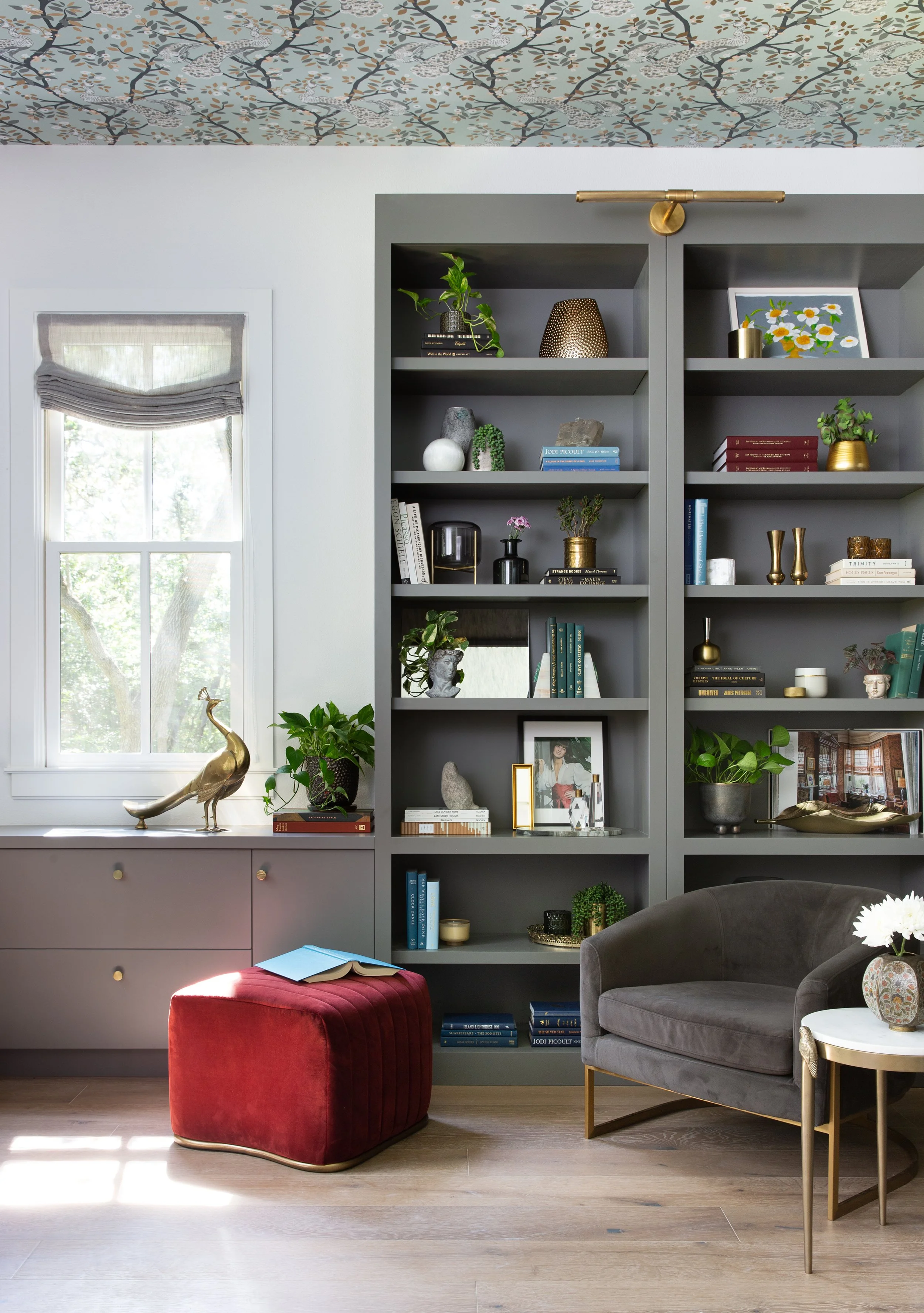 Living room bookshelves with comfortable seating and natural light