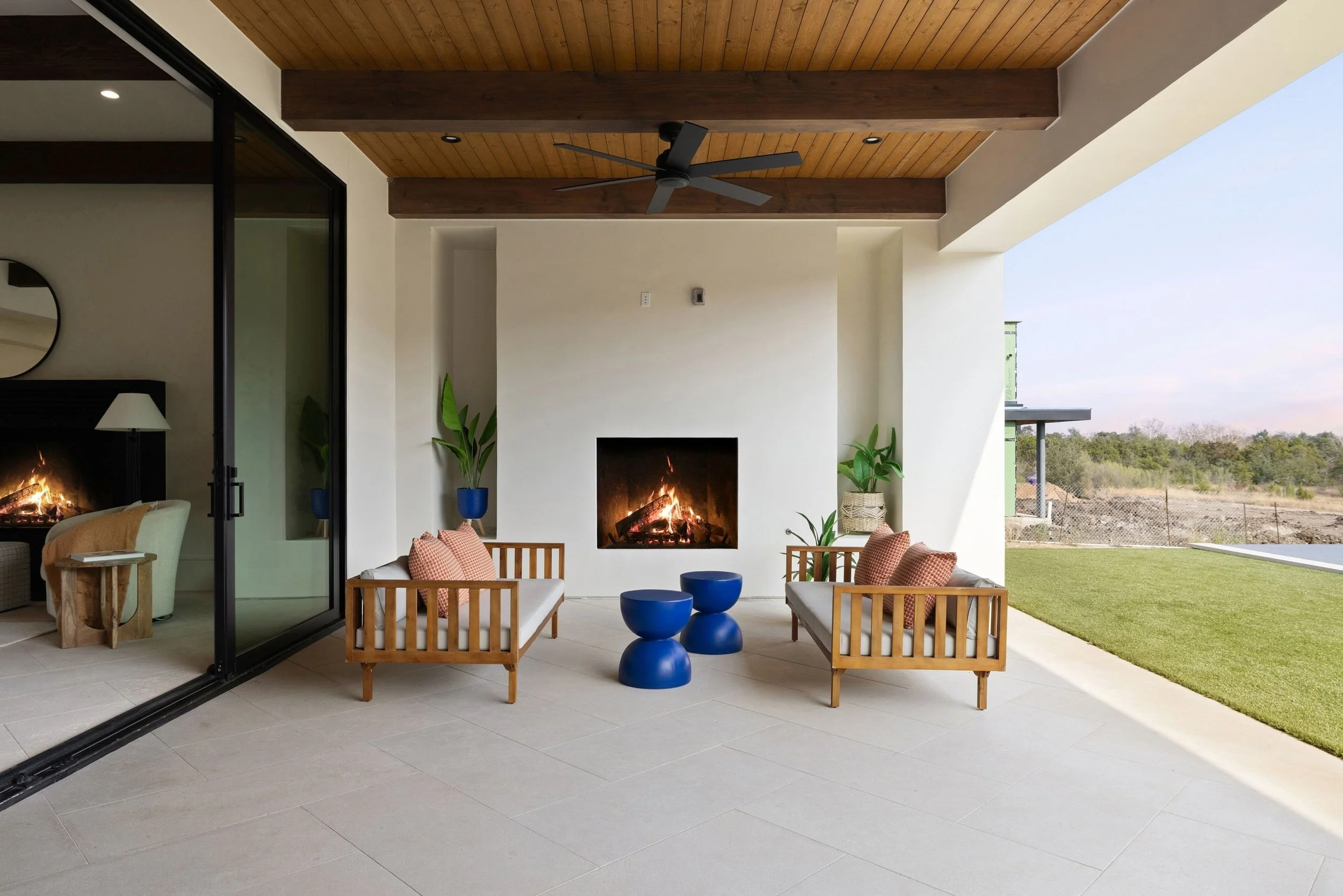 Outdoor seating area, exposed beams, fireplace and backyard access