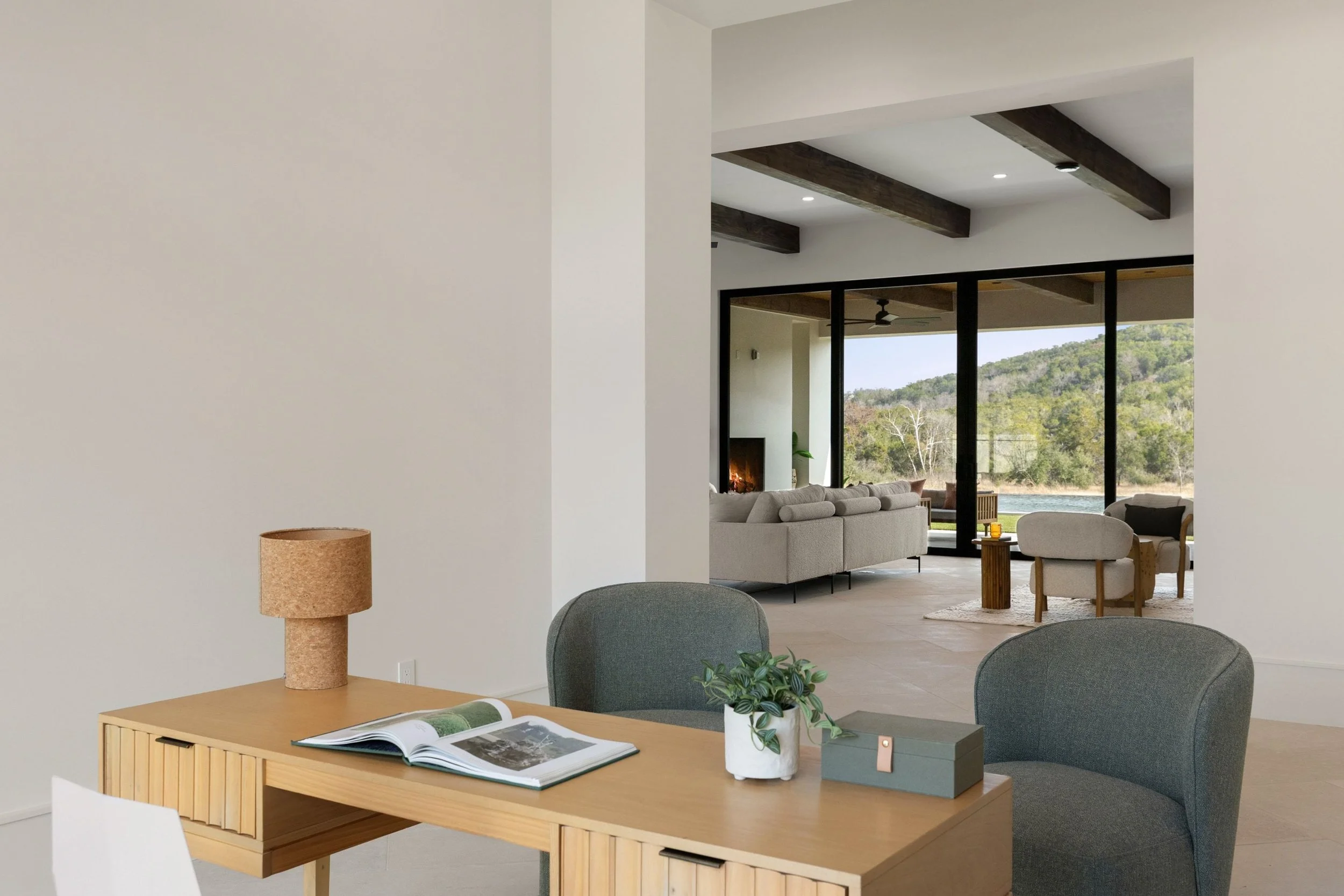 Home office with wood desk and large picture windows