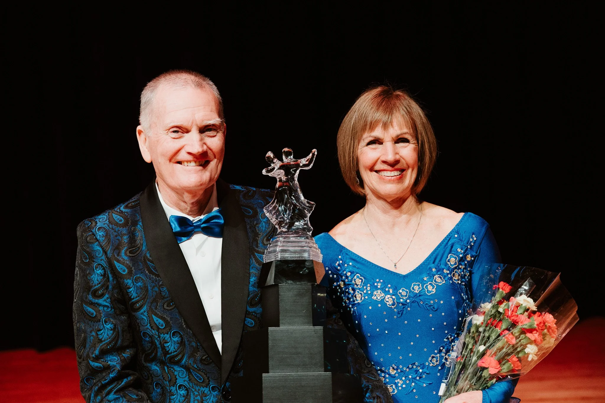 Dancing couple with trophy