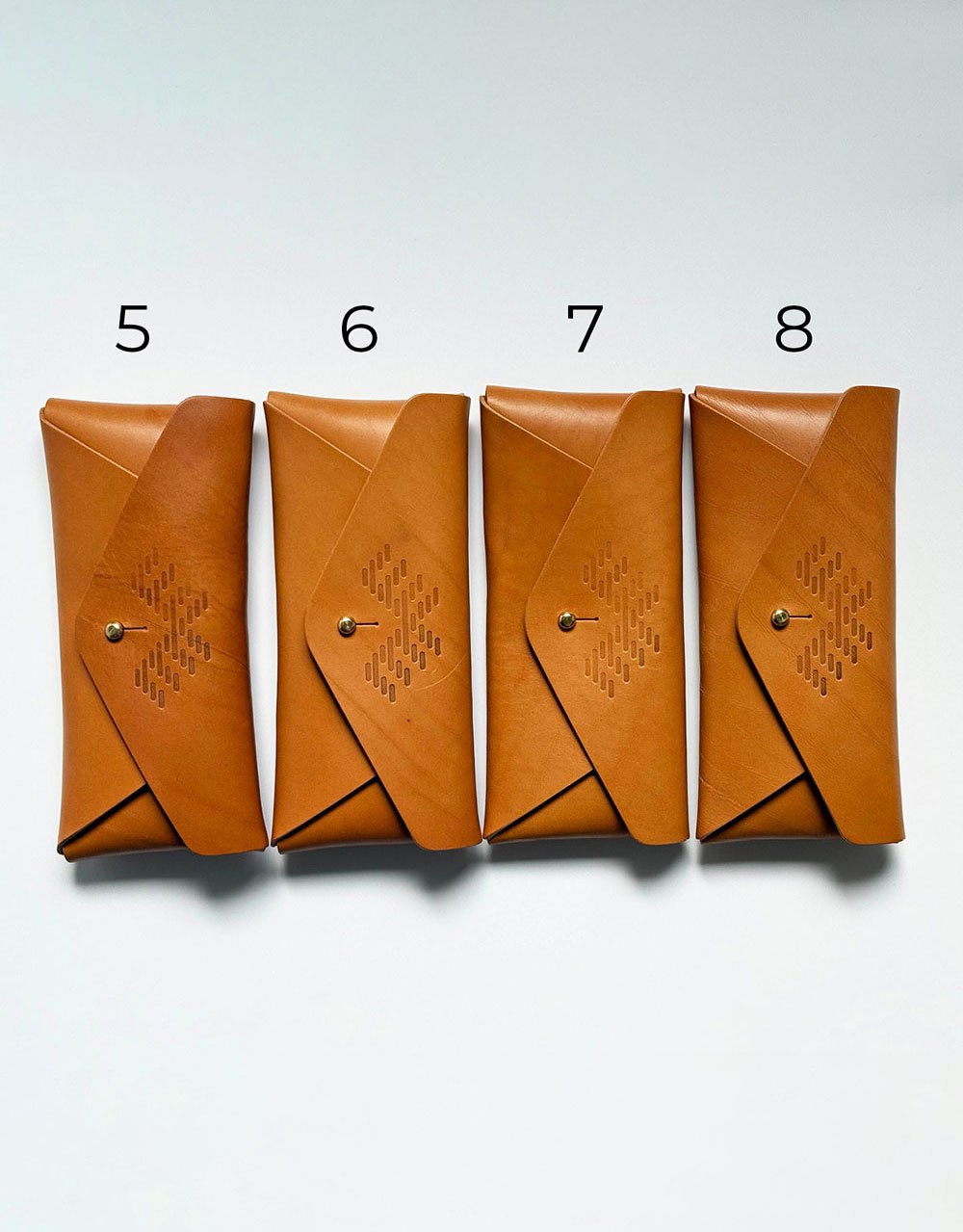 Aleks-Byrd-Hide-and-Hammer-Leather-Envelope-Clutch-bag-seconds-bags5-8-fronts-numbered-Aleks-Byrd-Designs-web.jpg