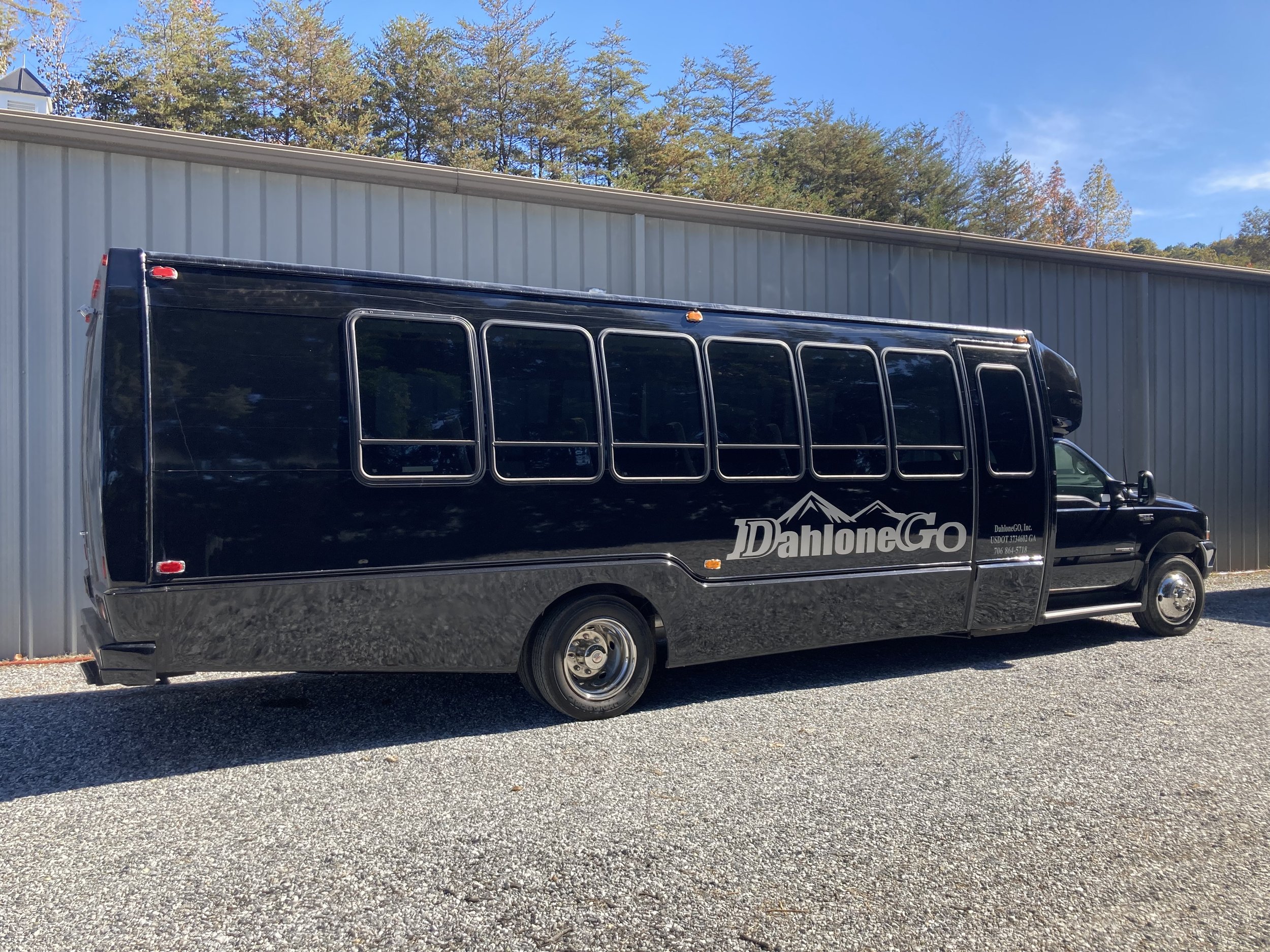 Exterior of Black 28 Passenger Shuttle