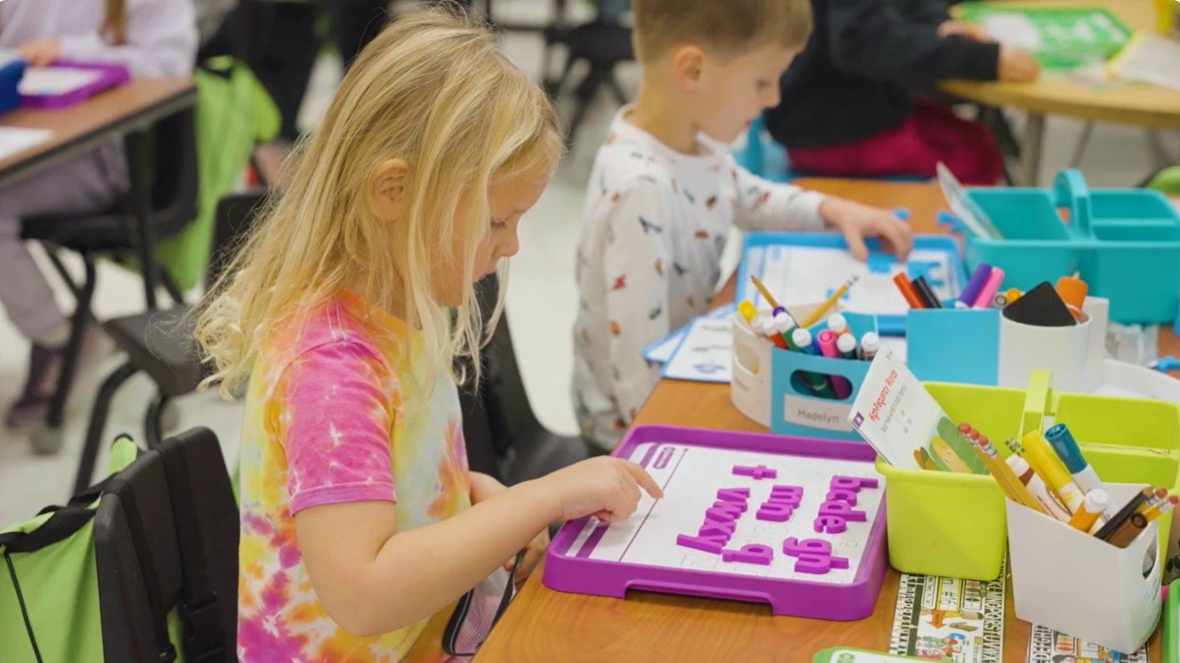 kindergartener doing school activites