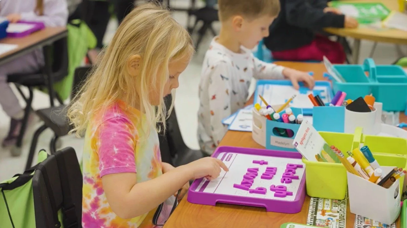 kindergartener doing school activites