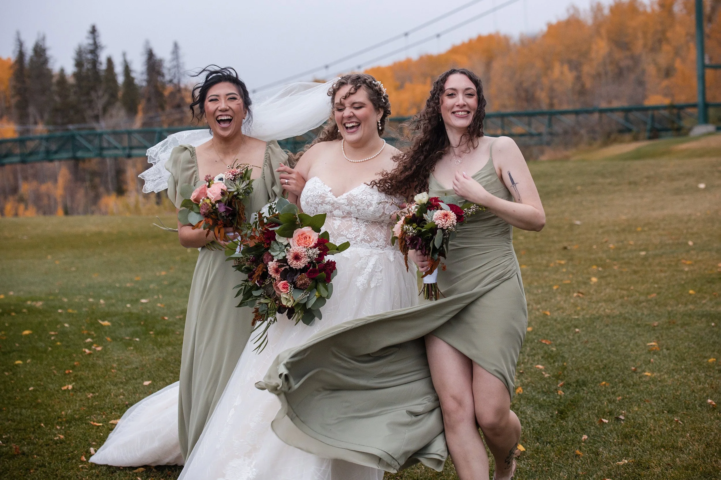 Wedding party walking in windy fall wedding at Edmonton Golf and Country Clud 