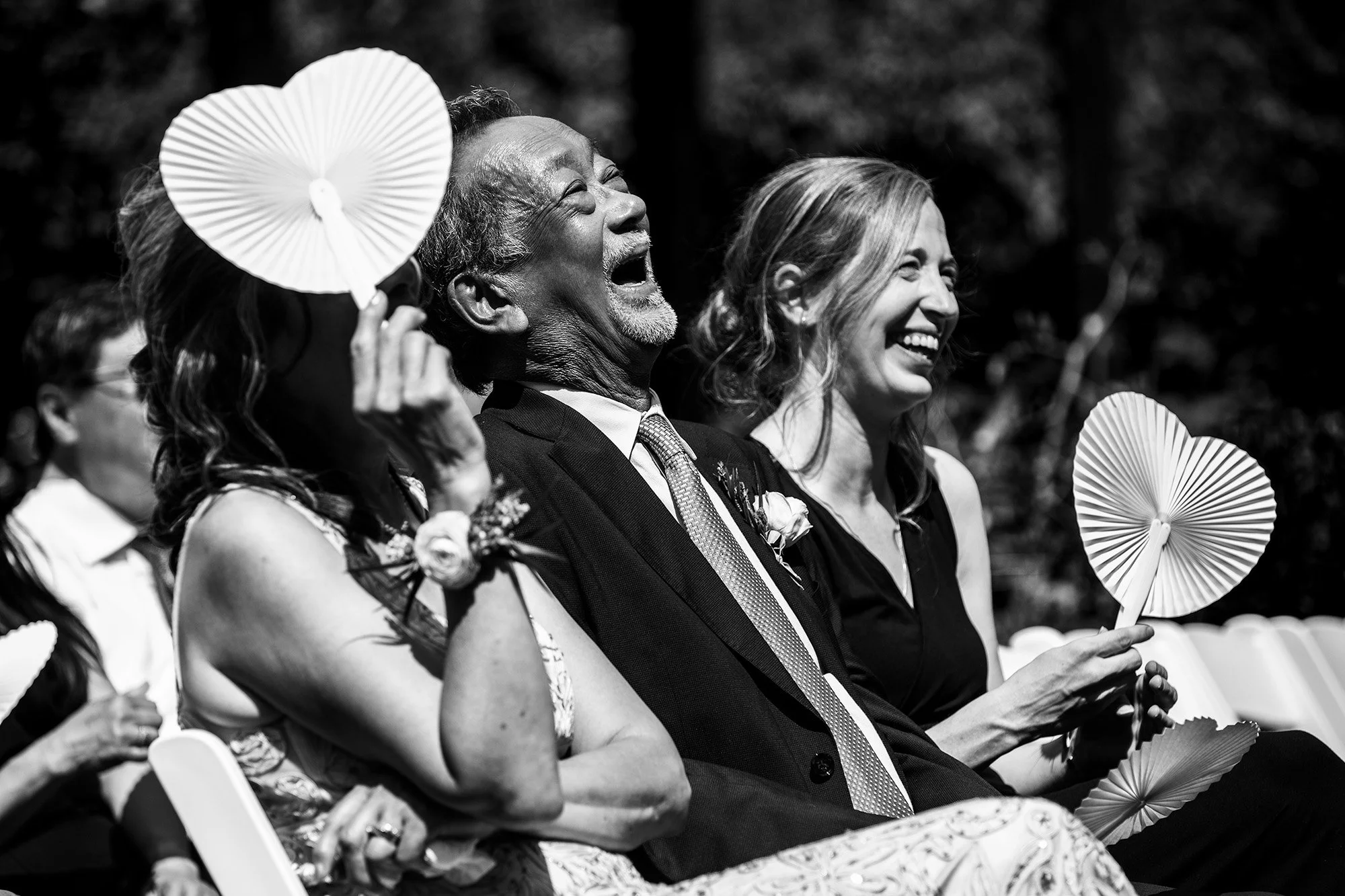 Father of the Groom laughing during outdoor wedding Edmonton 