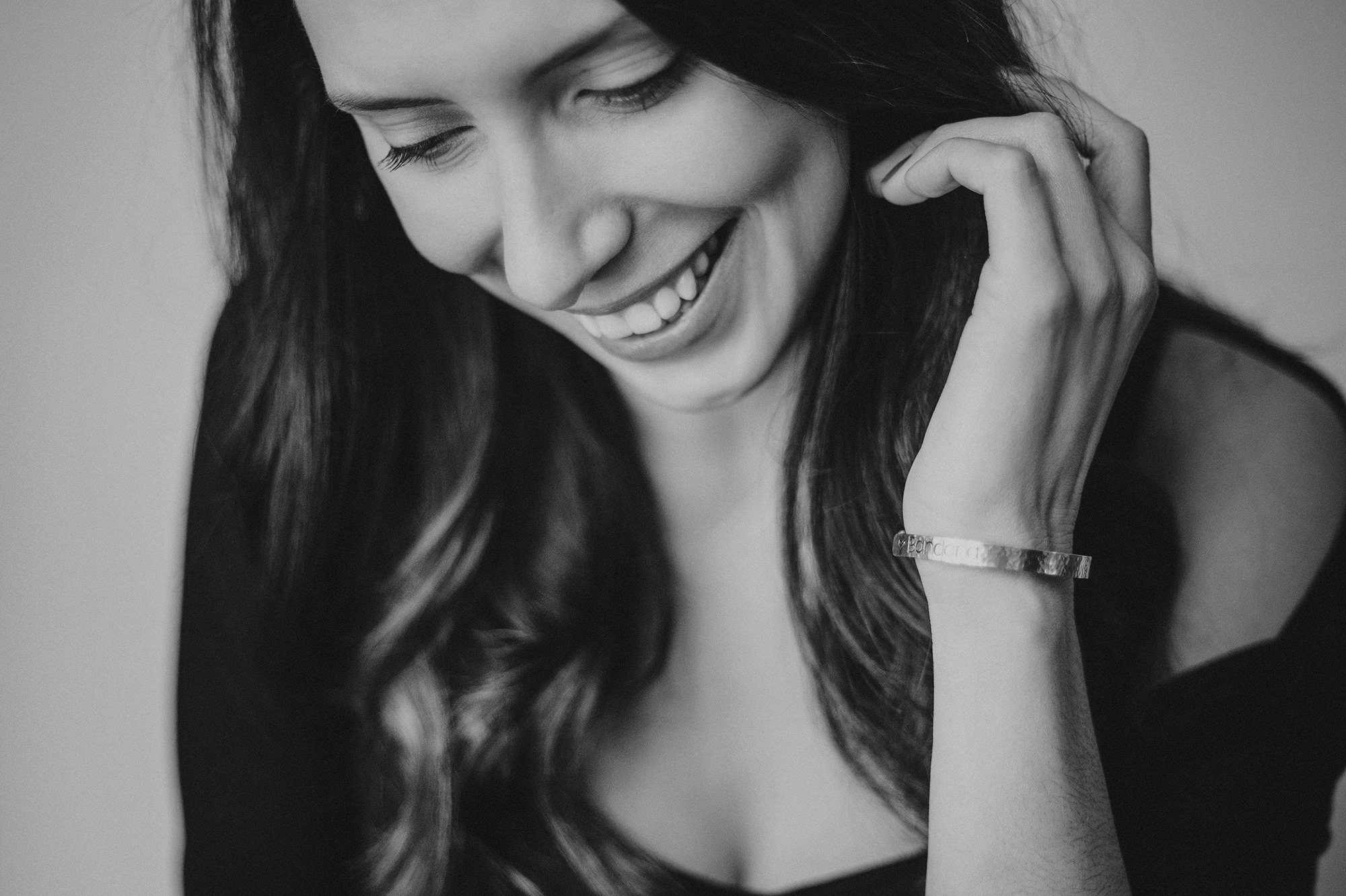Black and white close-up of a smiling Lauren Hannah, Edmonton wedding photographer