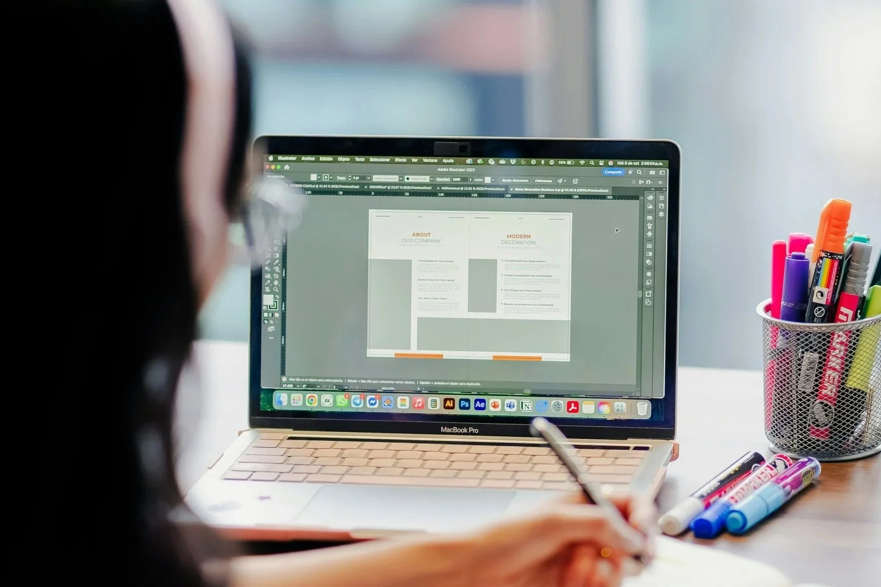 Woman looking at wireframe on screen