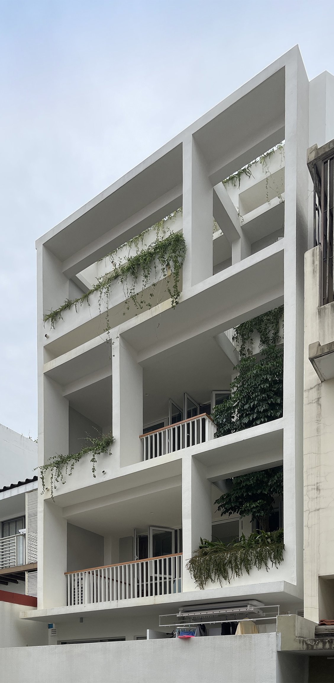 Landed house facade, hanging gardens, verandahs, tropical living, Singapore