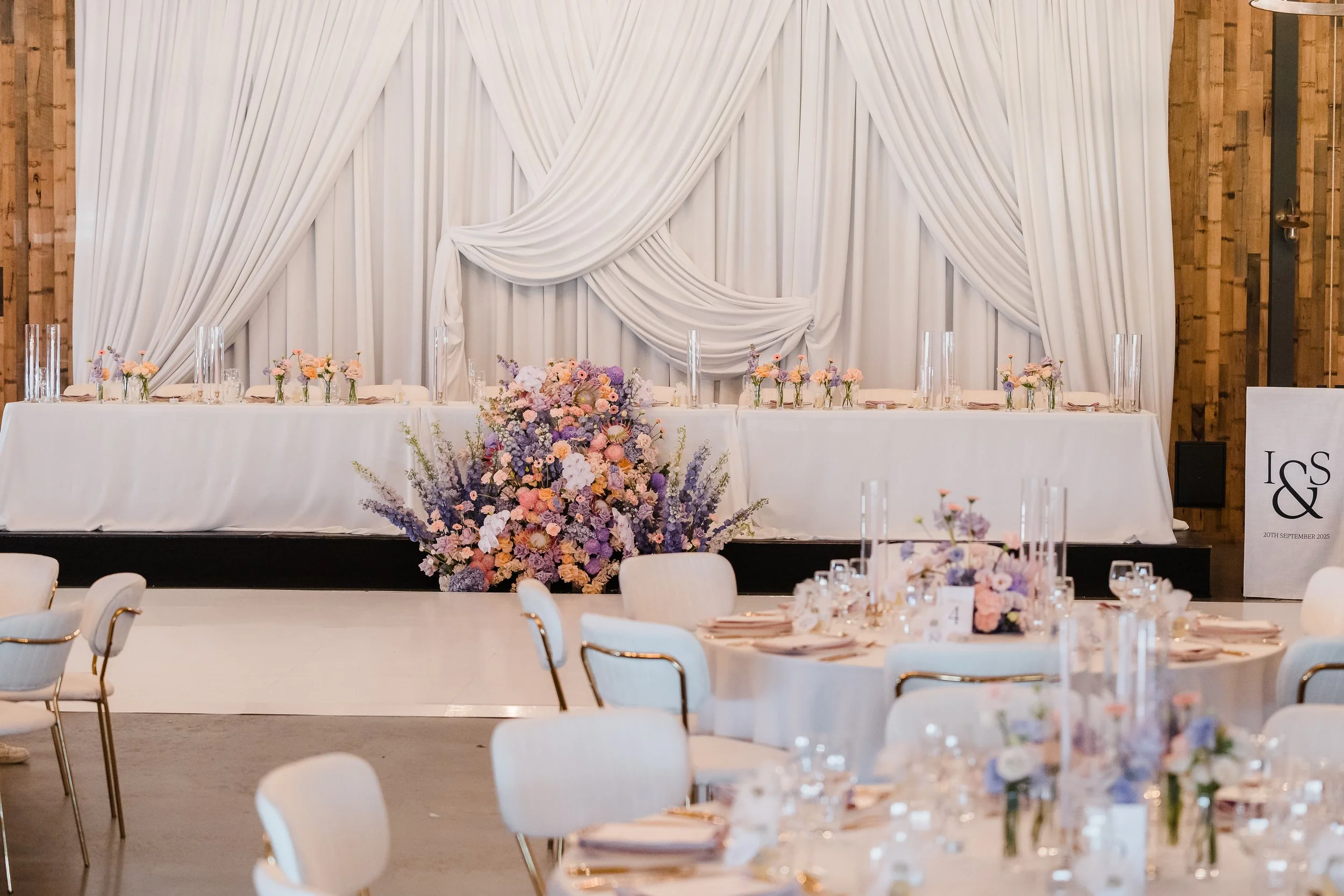 Pastel, elegant, romantic reception styling at Sandalford Estate, white draped bridal table backdrop