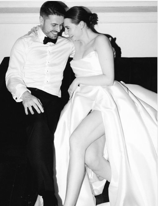 Bride and groom sitting on sofa a Moana Hall, Perth, black tie wedding