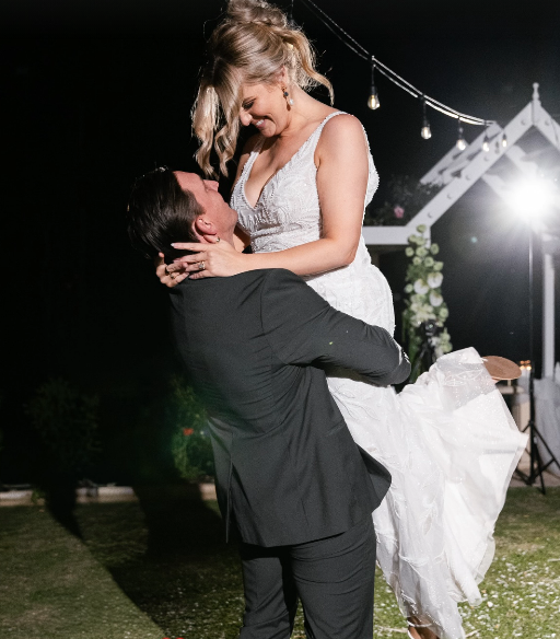 Bride and groom in lift on dance floor