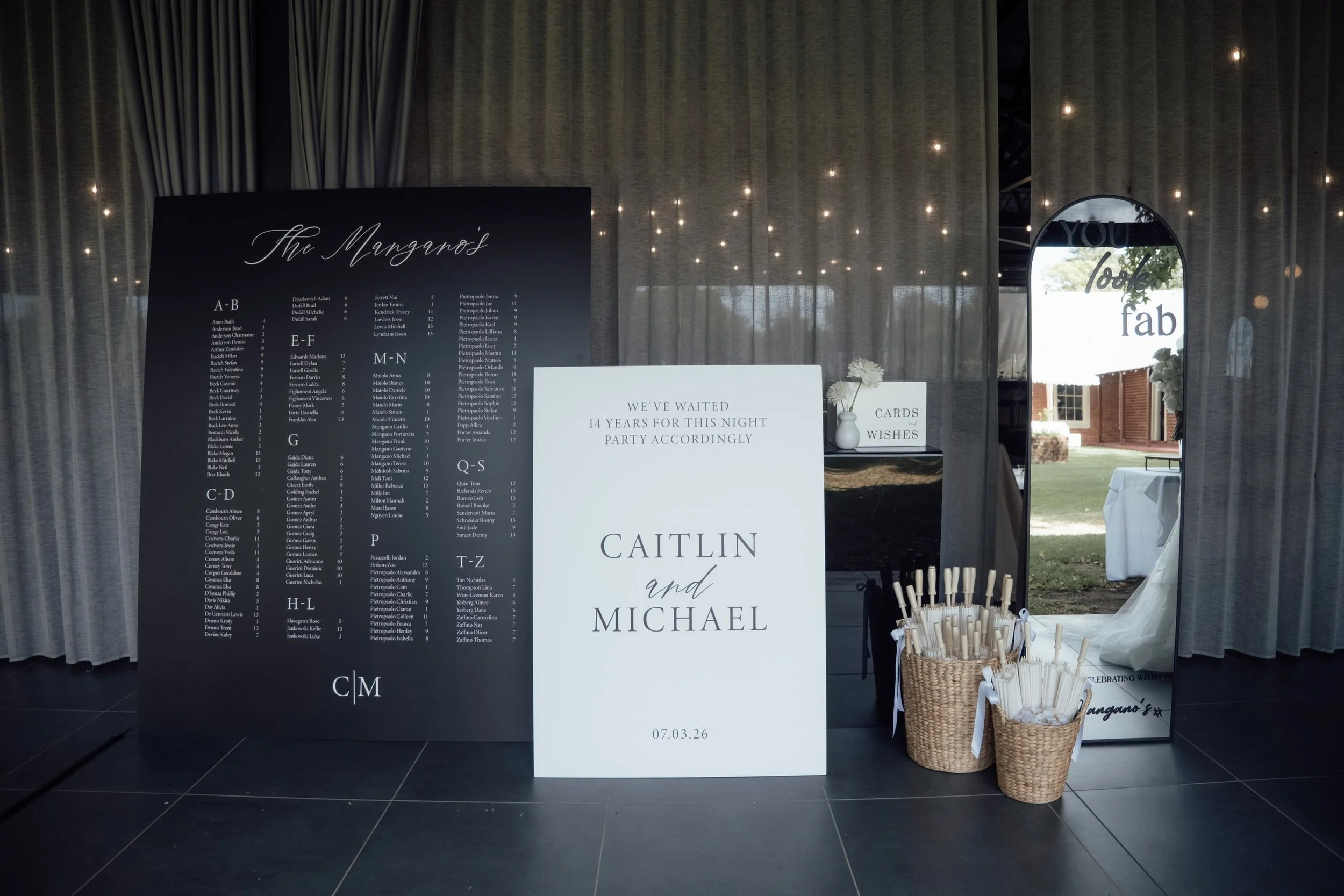 Feature modern wedding welcome sign, wishing well and seating chart display at Nikola Estate Pavillion entrance. 