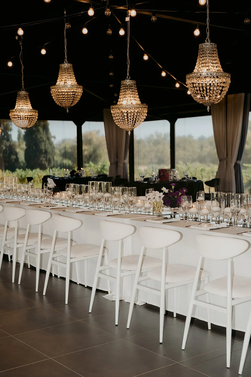 Feature banquet bridal table styled with reflective details and statement décor.