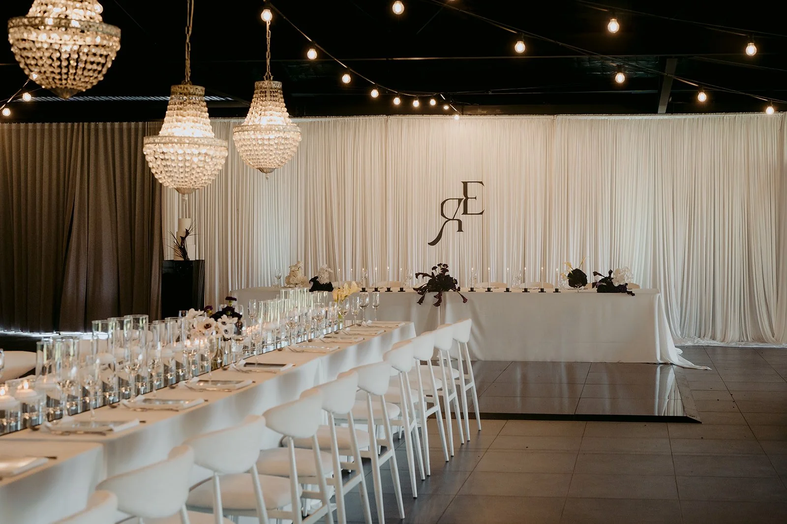 Luxury wedding reception design featuring dramatic details and elegant contemporary styling.
