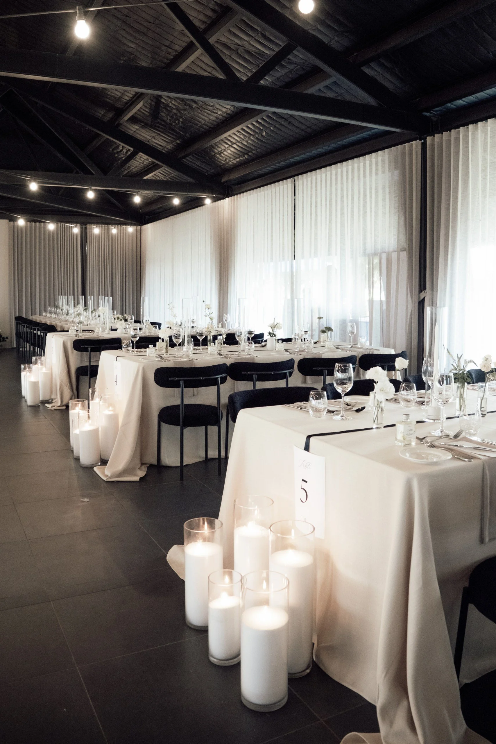 Reception design featuring a neutral palette and sculptural styling at Nikola Estate Pavilion.