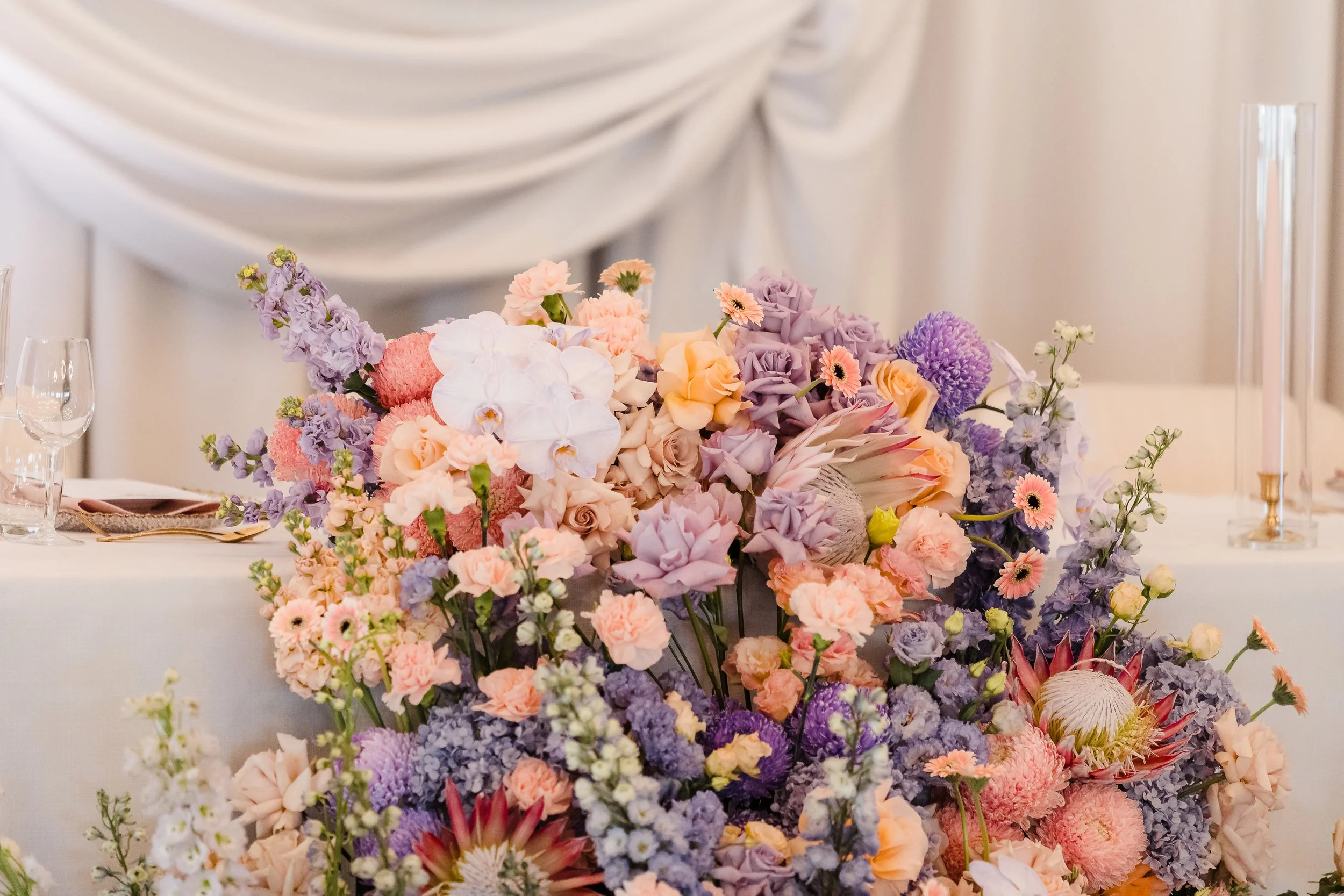 Cascading head-table installation and draped backdrop